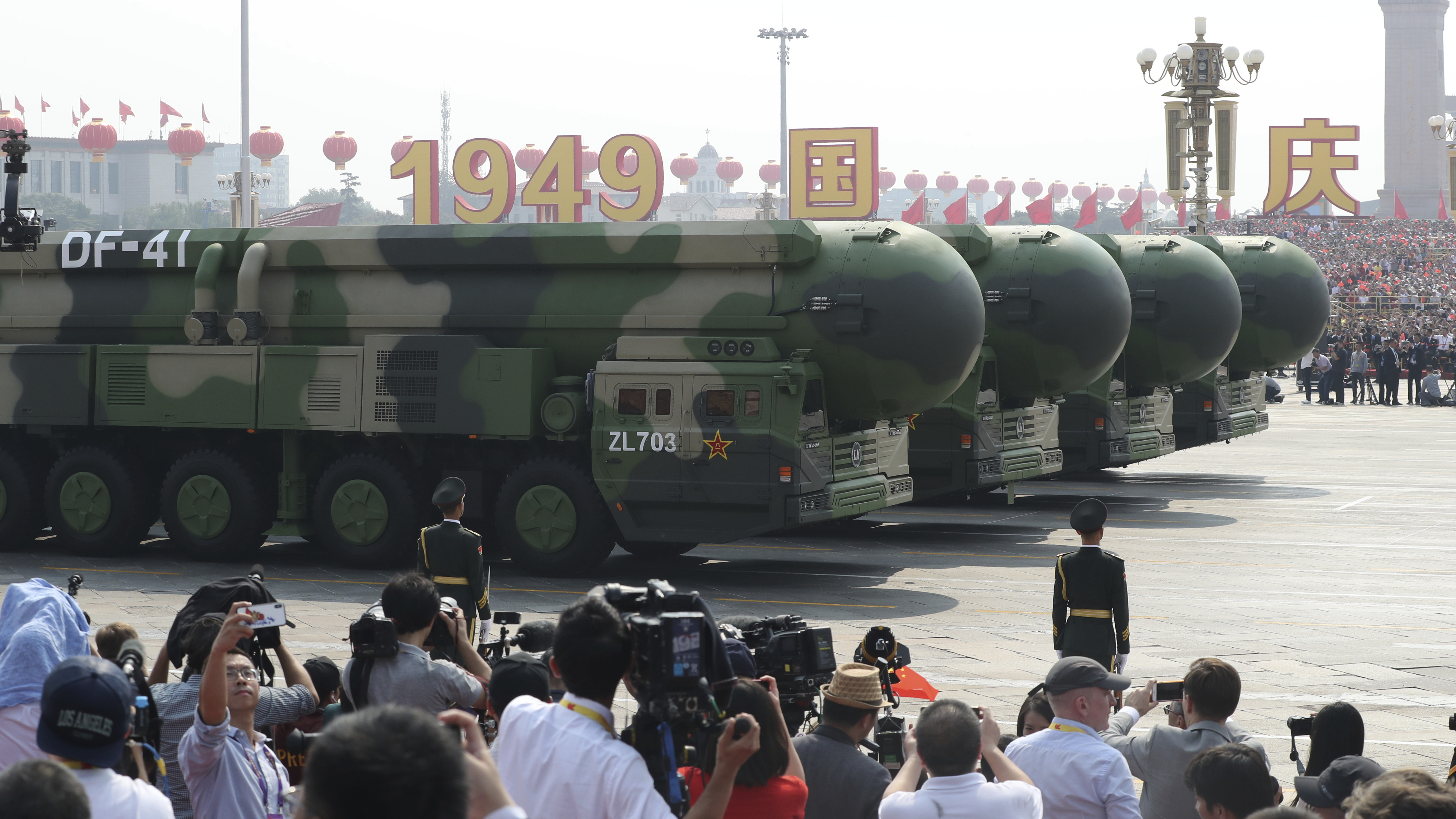 Military vehicles equipped with the latest DF-41 ballistic missile roll by during the parade to commemorate the 70th anniversary of the founding of Communist China in Beijing on Tuesday.