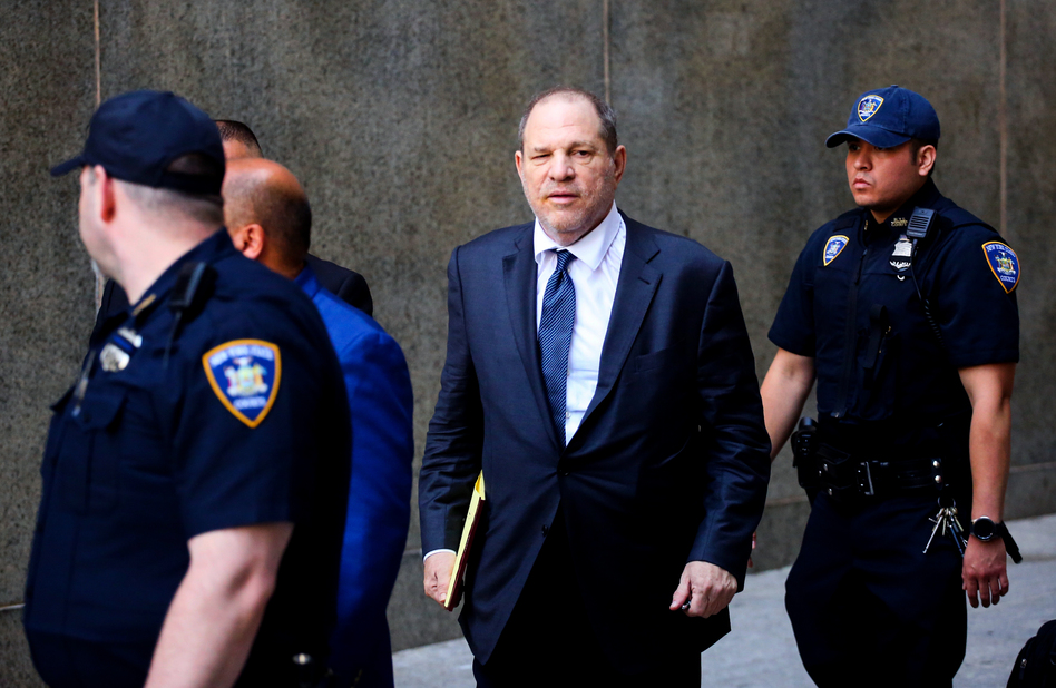Movie producer Harvey Weinstein (center) leaves the courthouse after appearing in criminal court on sexual assault charges in July in New York City. In his first comments after the scandal broke, he said he was hoping for a 'second chance' and 'we all make mistakes.'