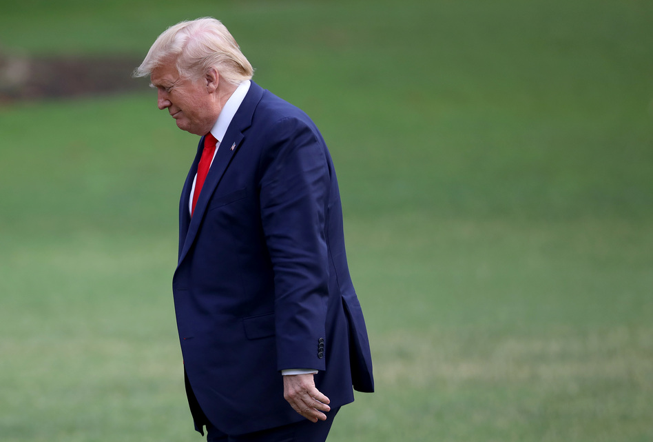 President Trump returns to the White House Thursday after traveling to Florida earlier in the day. He did not take questions from gathered reporters. (Win McNamee/Getty Images)
