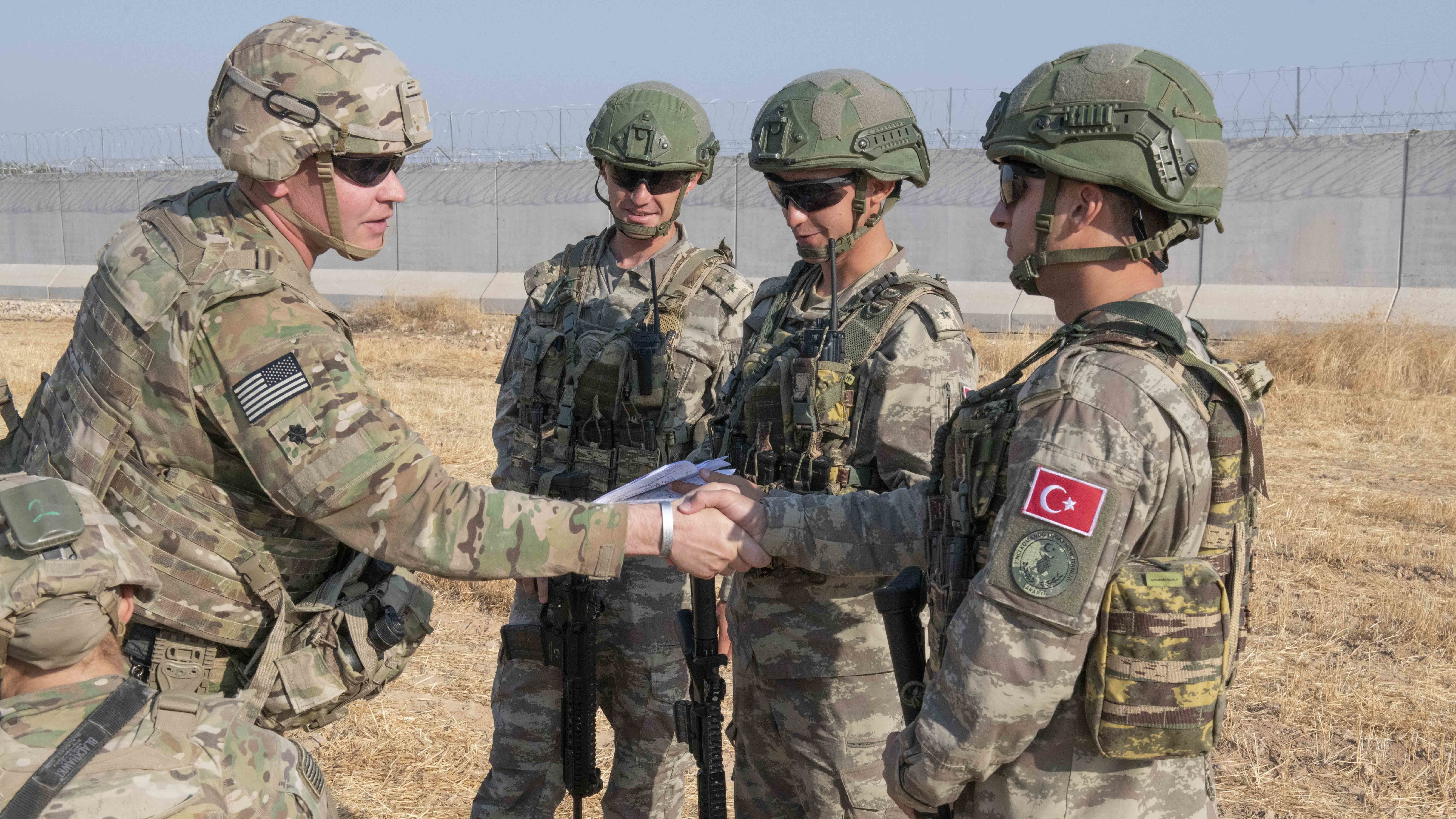 U.S. allies in the Syrian Democratic Forces say the White House's decision to pull troops from the Syria-Turkey border has left them without hope. Here, a U.S. soldier is seen during a joint patrol with Turkish troops on Friday. (U.S. Army/Operation Inherent Resolve)