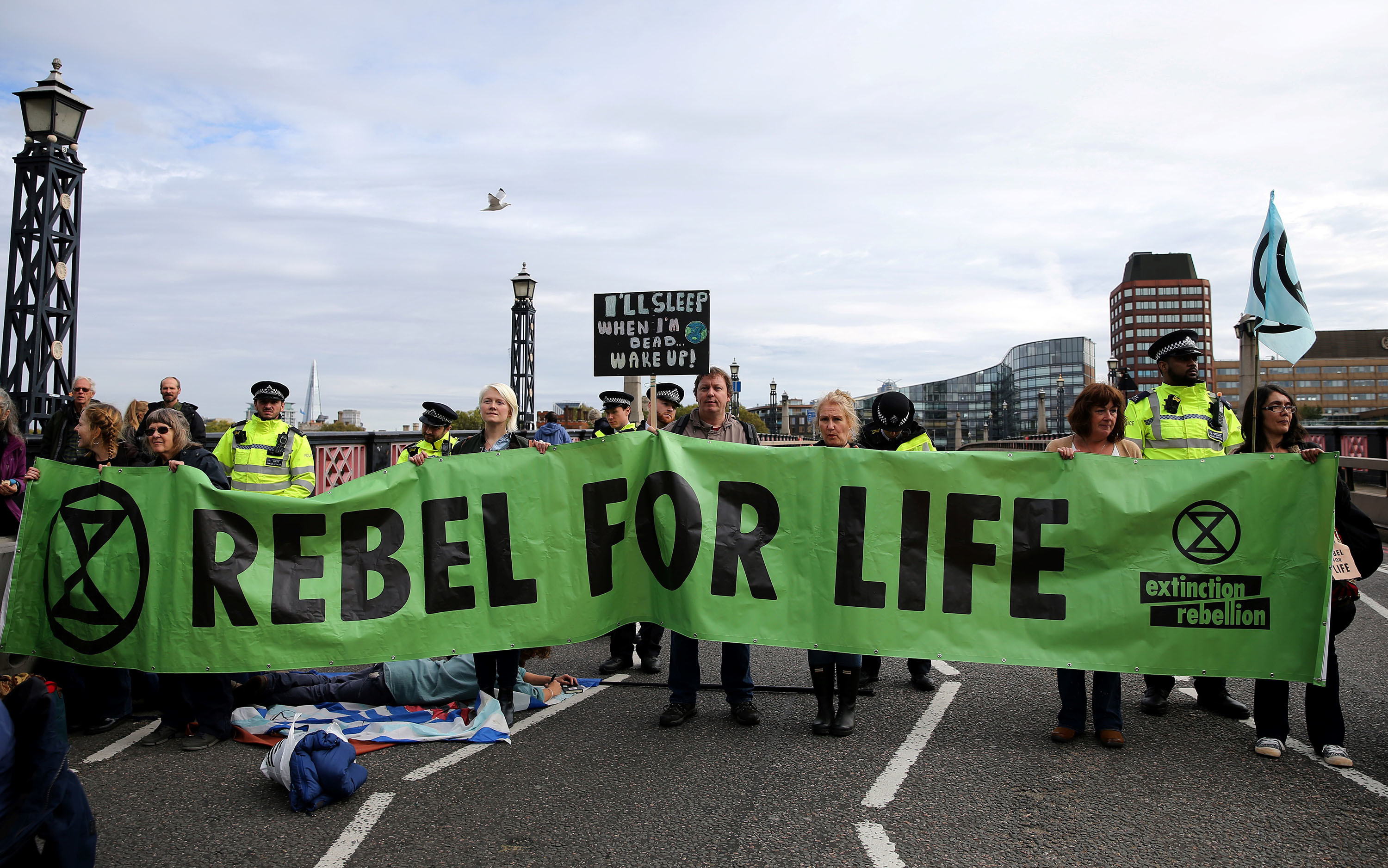Climate change activists from the group Extinction Rebellion demonstrate on Lambeth Bridge in central London on Monday. The group has planned protests in Europe, North America and Australia over the next two weeks. (AFP/Getty Images)