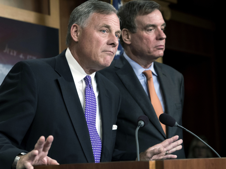 Senate Select Committee on Intelligence Chairman Richard Burr, R-N.C., (left) and Vice Chairman Mark Warner, D-Va., released a new report on how Russians used social media targeting to meddle with the 2016 election. (J. Scott Applewhite/AP)