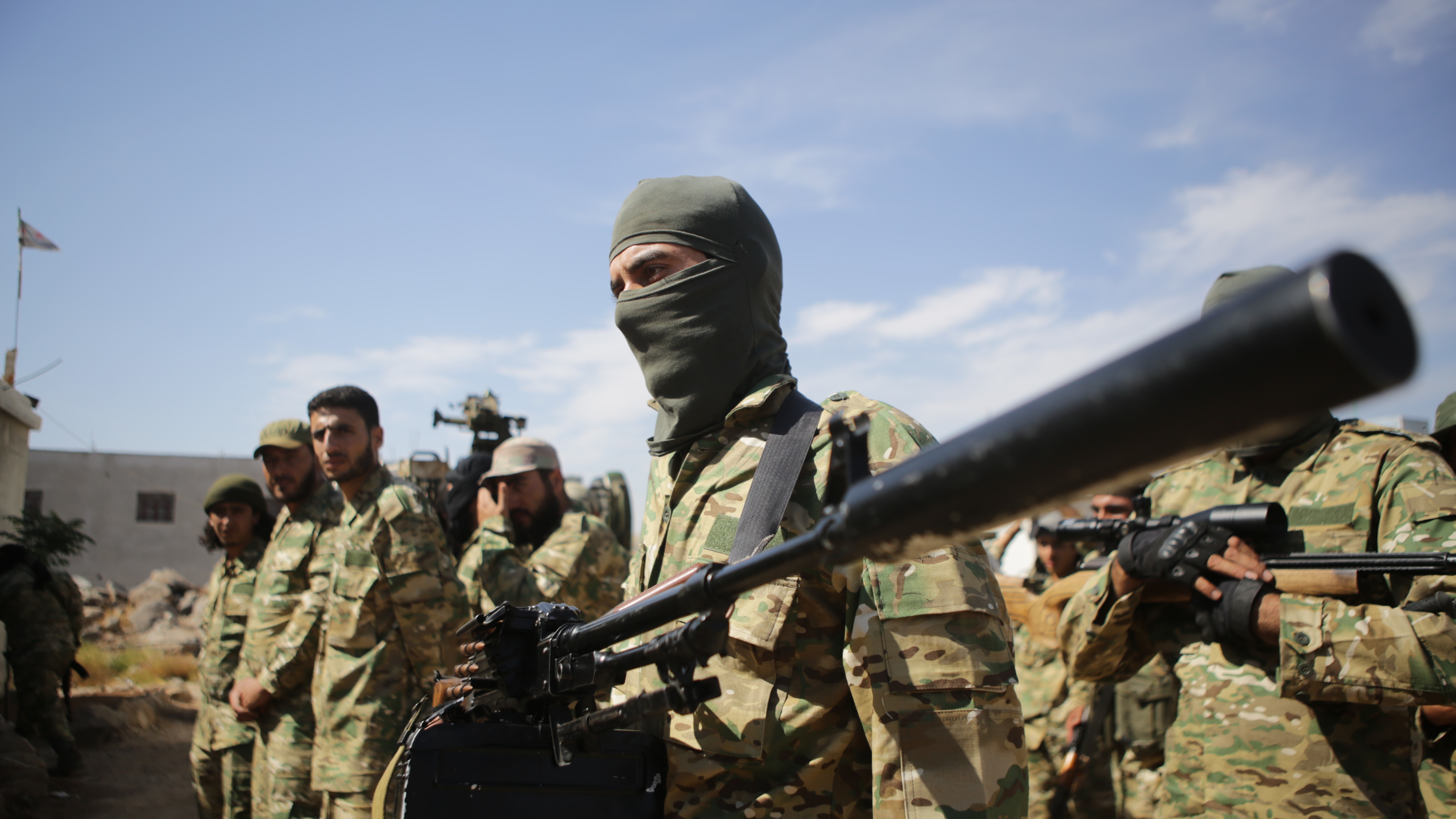 Syrian National Army forces are dispatched to the Manbij front line near Aleppo ahead of Turkey's planned operation in northern Syria, on Tuesday. (Anadolu Agency via Getty Images)