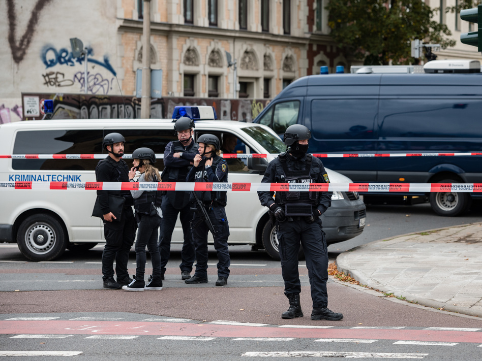 Police block access to a street near the scene of an attack that left two people dead on Wednesday in Halle, Germany. Initial reports indicate a man fired shots outside a synagogue and a kebab shop in the eastern German city. (Jens Schlueter/Getty Images)