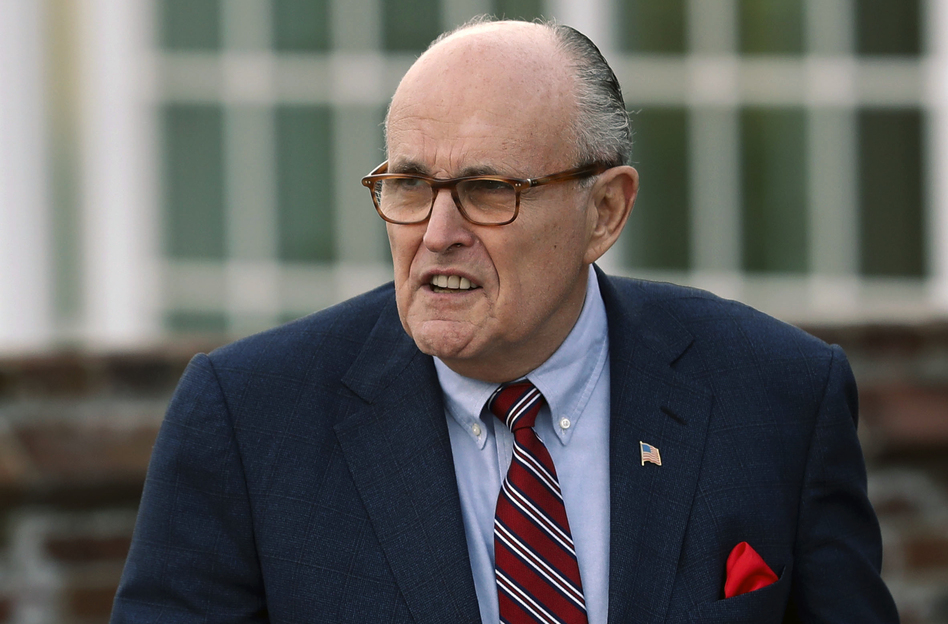 Associates of President Trump's personal lawyer Rudy Giuliani have been arrested on campaign finance charges. (Carolyn Kaster/AP)