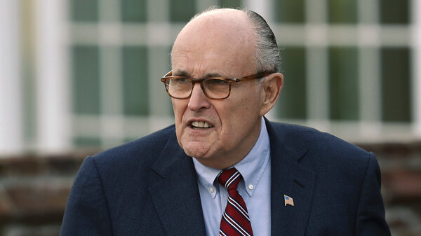 Associates of President Trump's personal lawyer Rudy Giuliani, pictured in May 2018, have been arrested on campaign finance charges.