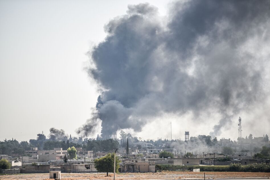 In this photo taken from the Turkish side of the border between Turkey and Syria, smoke billows from a fire inside Syria during bombardment by Turkish forces on Wednesday. (Bulent Kilic/AFP via Getty Images)