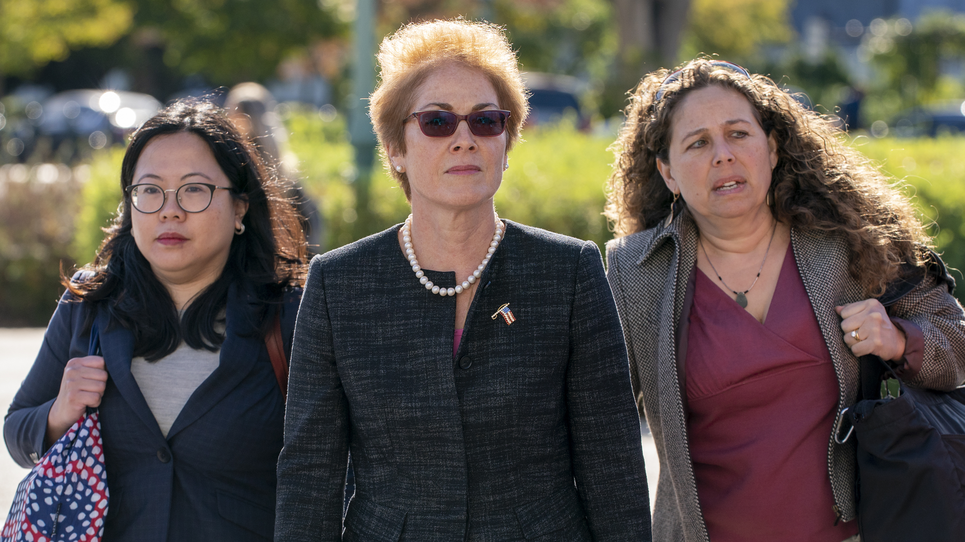 Former U.S. ambassador to Ukraine Marie Yovanovitch (center) arrives on Capitol Hill Friday for congressional testimony.