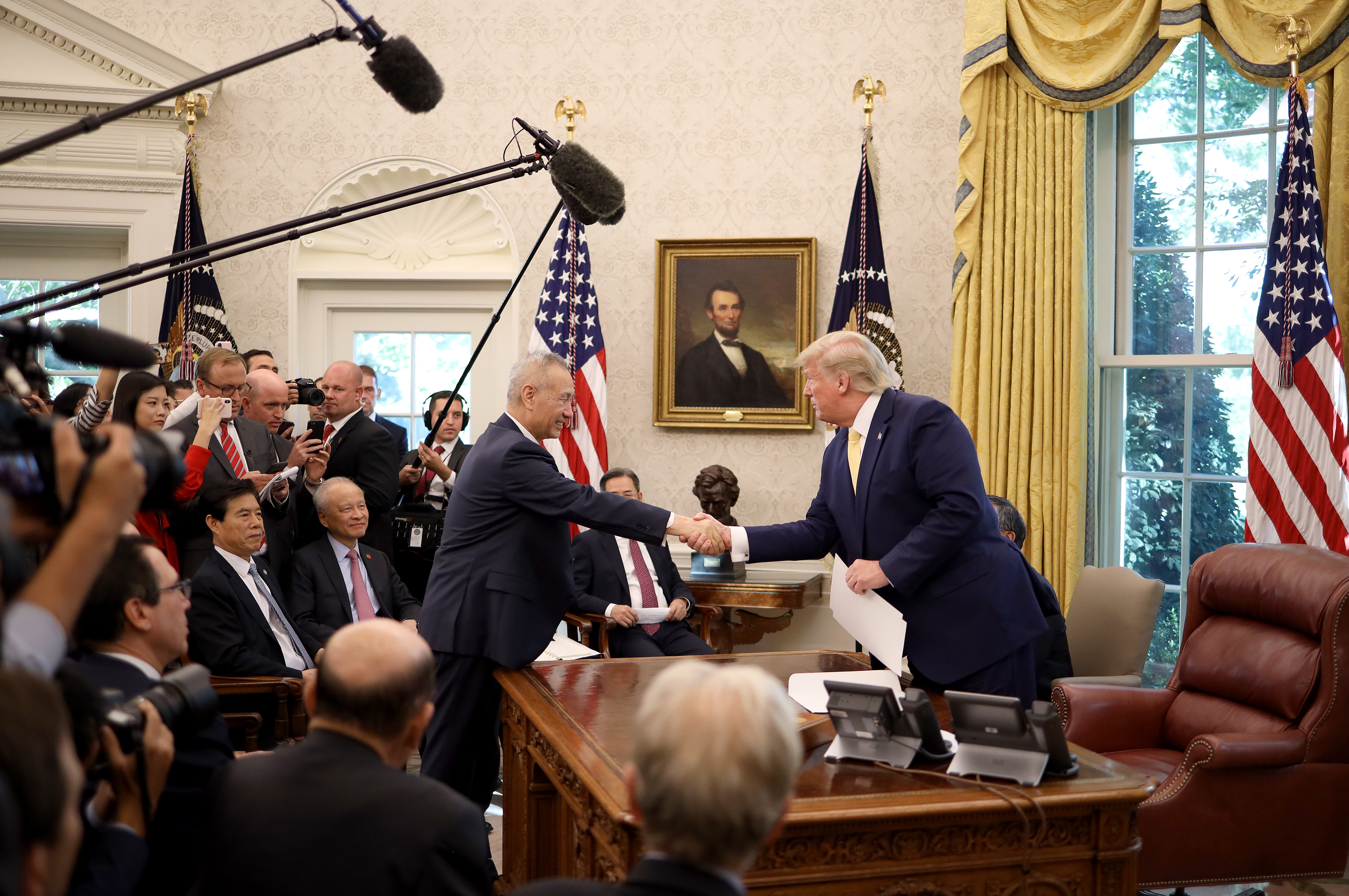 President Trump shakes hands with Chinese Vice Premier Liu He in the Oval Office at the White House on Oct. 11 in Washington, D.C. Trump announced a 'Phase 1' partial trade deal with China. (Getty Images)