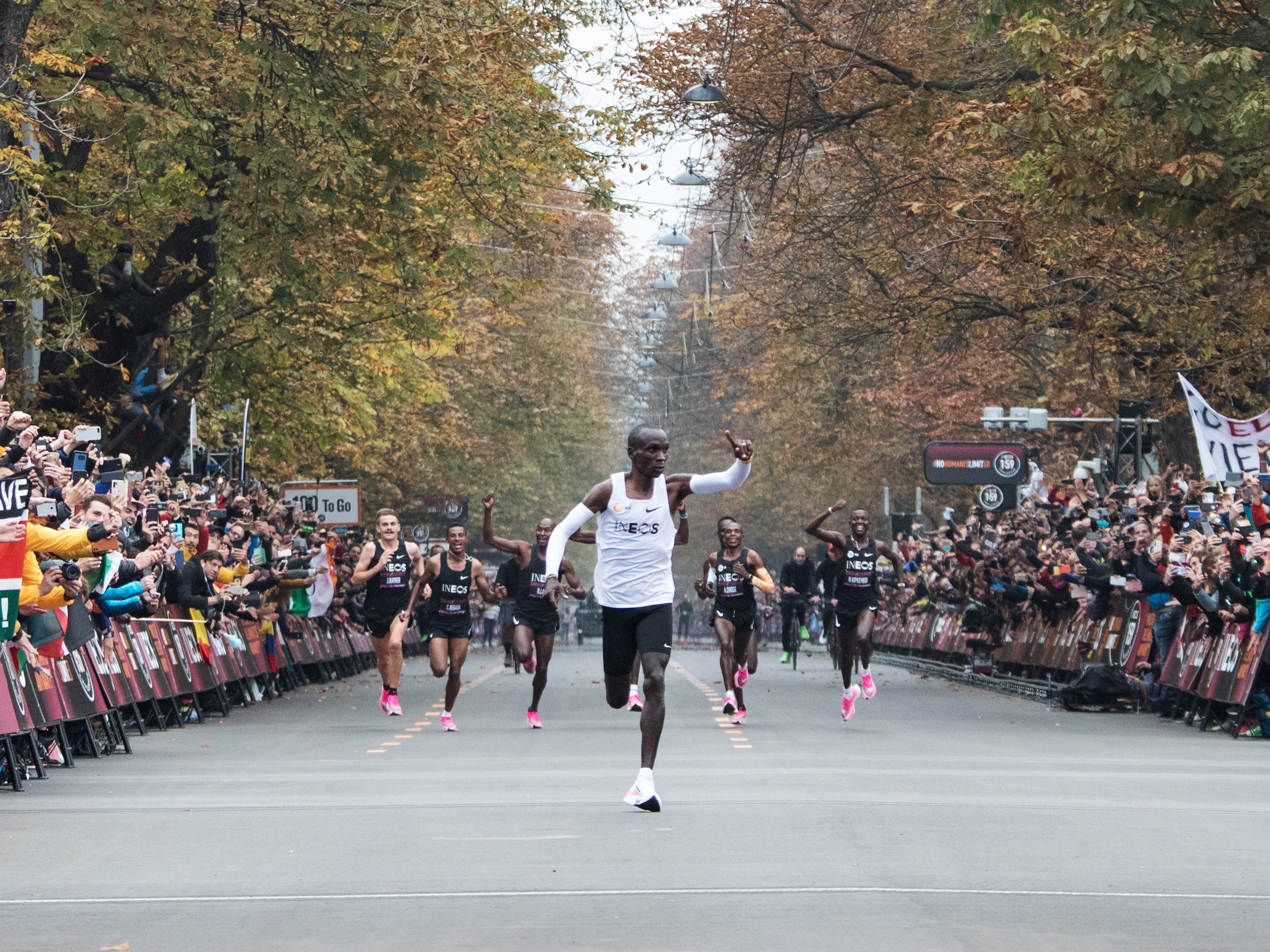 Kenya's Eliud Kipchoge celebrates after busting the elusive two-hour barrier for the marathon Saturday in Vienna. (AFP via Getty Images)