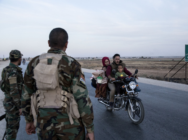 Syrian government troops on Monday moved into towns in northern Syrian formerly controlled by U.S.-backed Kurdish militants. That sets up a potential clash with Turkish forces. (Baderkhan Ahmad/AP)