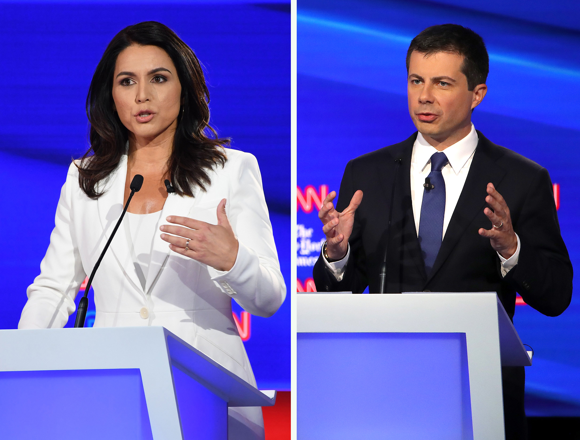 Hawaii Rep. Tulsi Gabbard and South Bend, Ind., Mayor Pete Buttigieg answer questions during Tuesday night's debate in Ohio. The two military veterans each took a very different tack when it came to the latest foreign policy crisis over Syria and Turkey. (Getty Images)