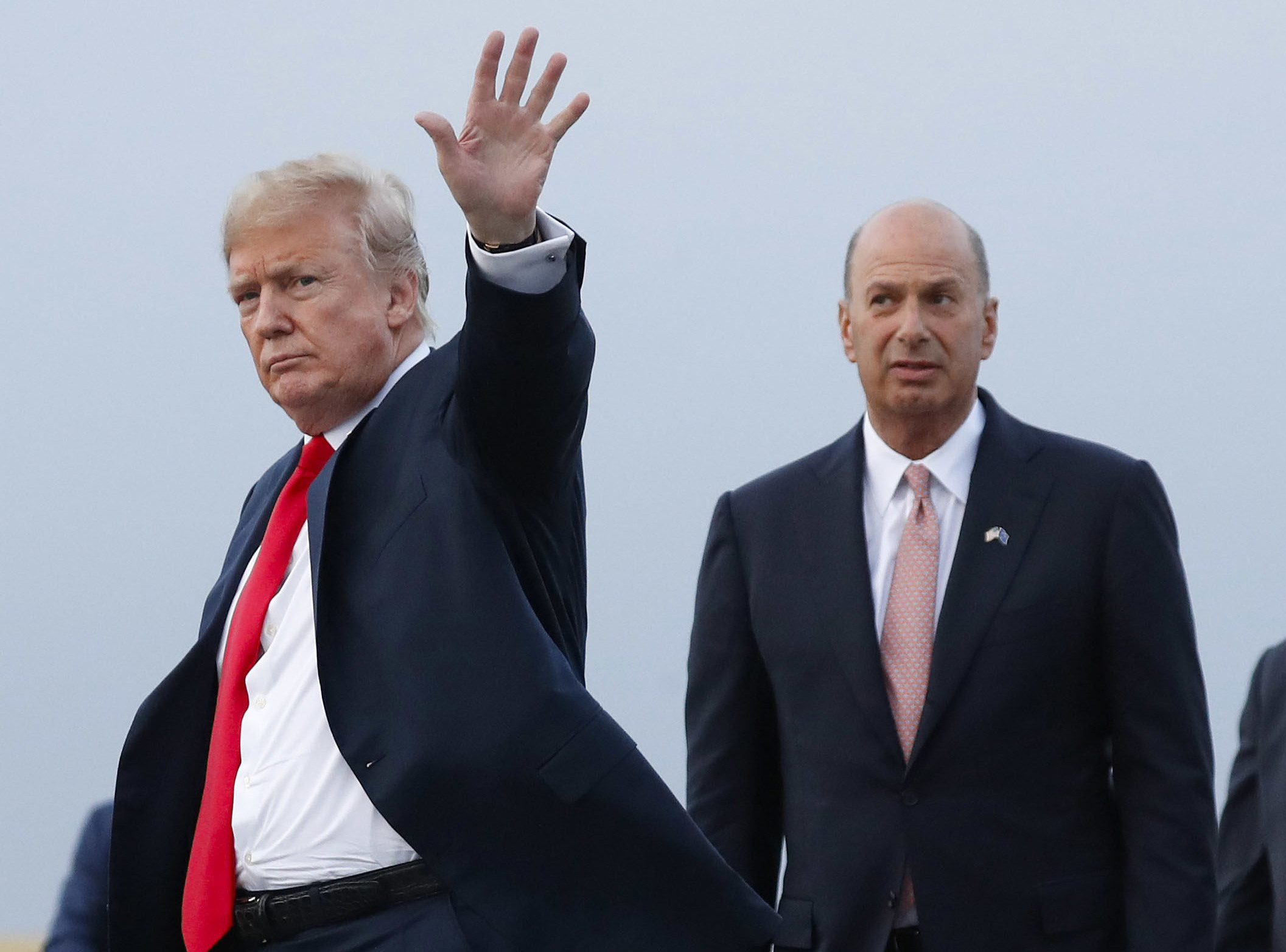 In this July 10, 2018, file photo, President Donald Trump is joined by Gordon Sondland, the U.S. ambassador to the European Union, as he arrives at Melsbroek Air Base, in Brussels, Belgium.