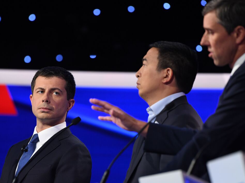 Democratic presidential hopeful Mayor Pete Buttigieg looks on as former Texas Rep. Beto O'Rourke speaks during the fourth Democratic primary debate of the 2020 presidential campaign season on Tuesday. (Saul Loeb/AFP via Getty Images)