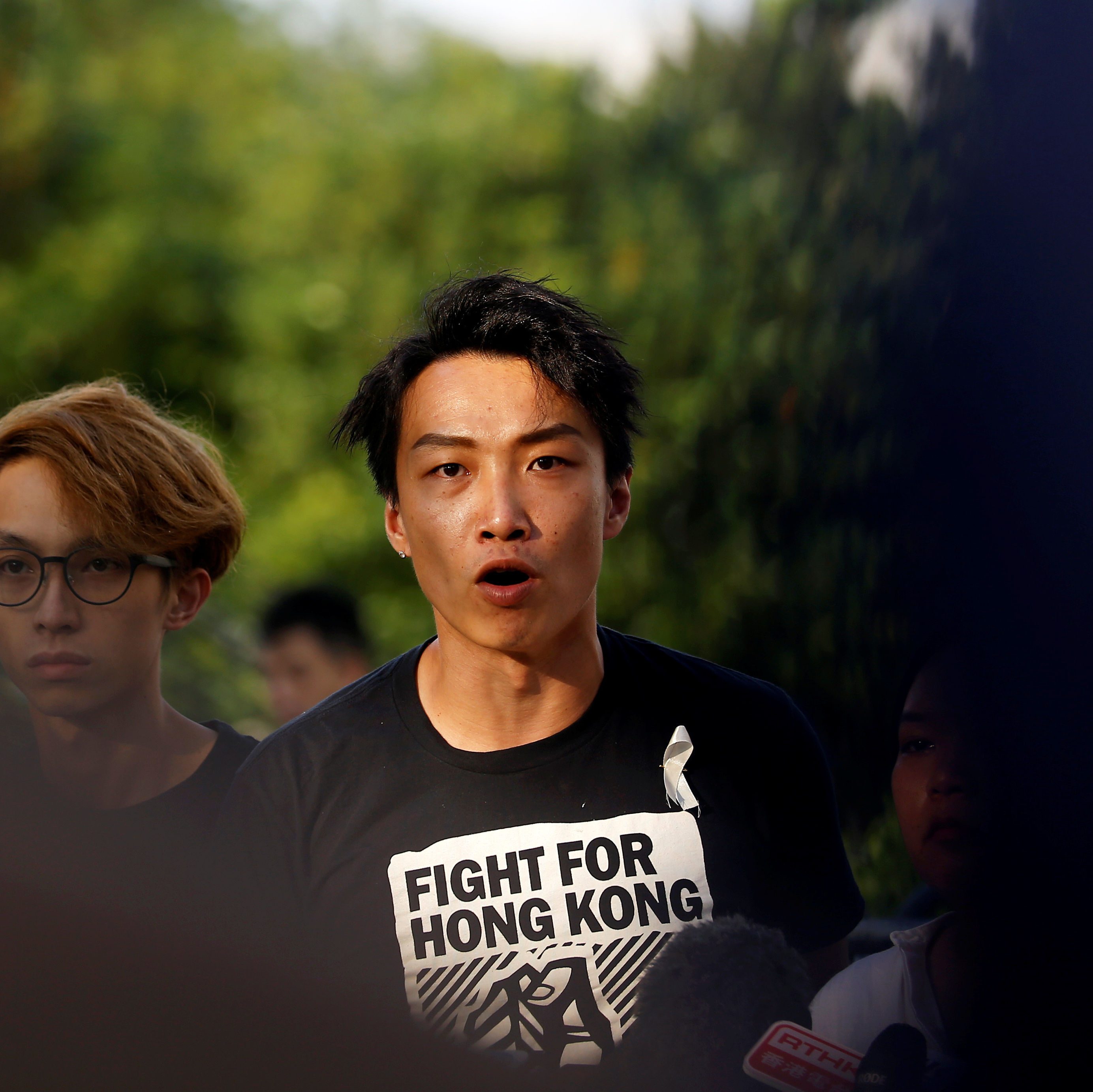 Jimmy Sham, seen speaking at a news conference in June, was left bloodied and dazed after being attacked by a group of people reportedly wielding hammers. (Reuters)