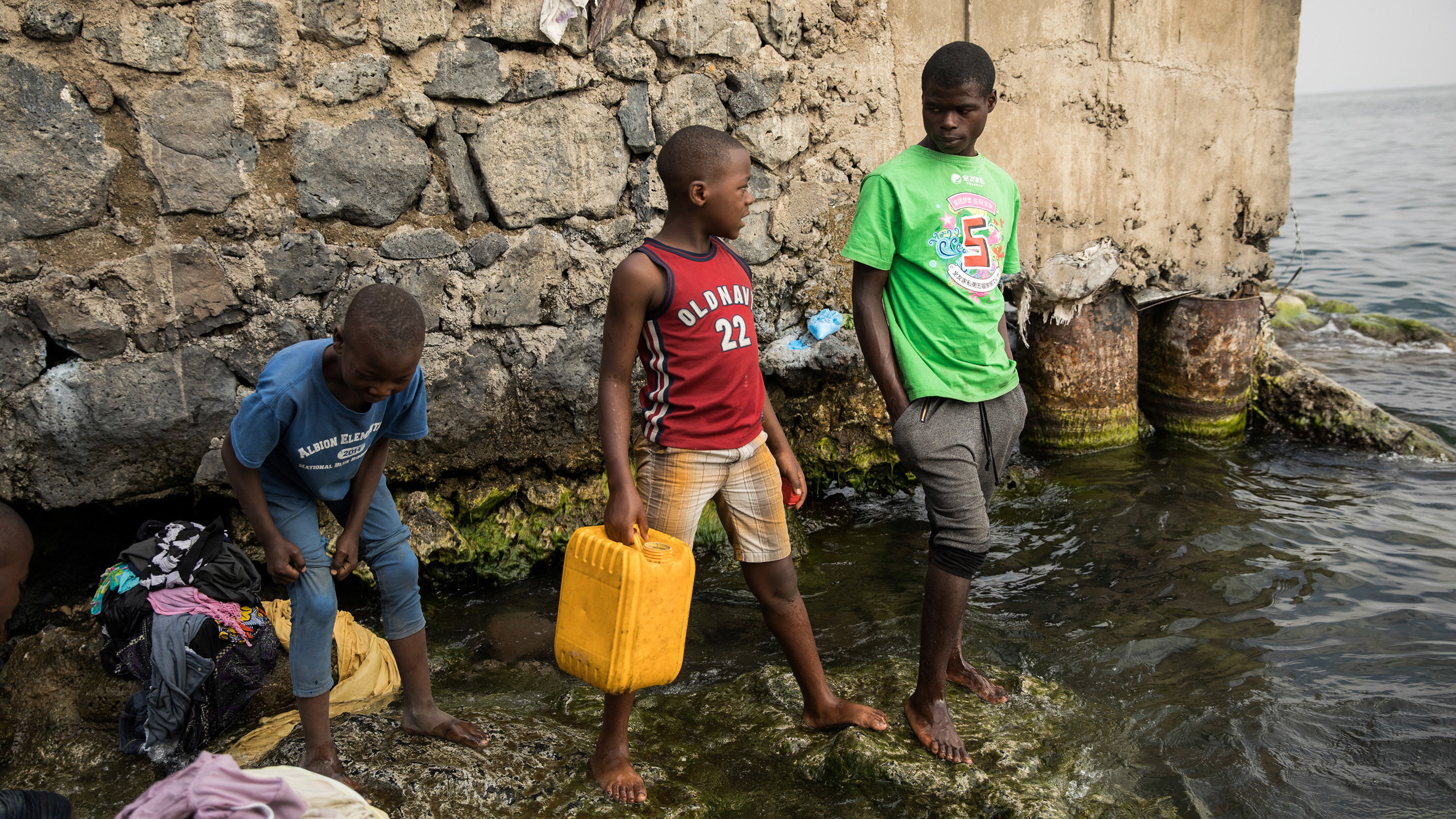 Pascal Bitasimwa, 12, of Goma (in the red shirt) goes to Lake Kivu to fill up jerrycans with water. "This takes me much of my time," he says. "Instead of going to study, I come first to take water."