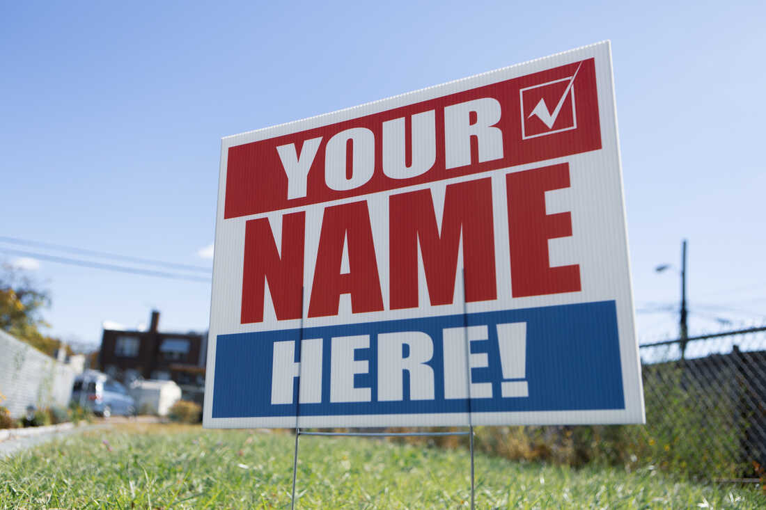 A campaign sign reads "Your Name Here!"