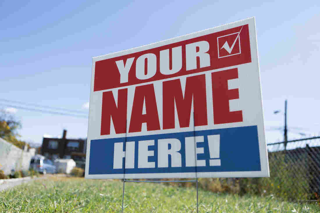 A campaign sign reads "Your Name Here!"