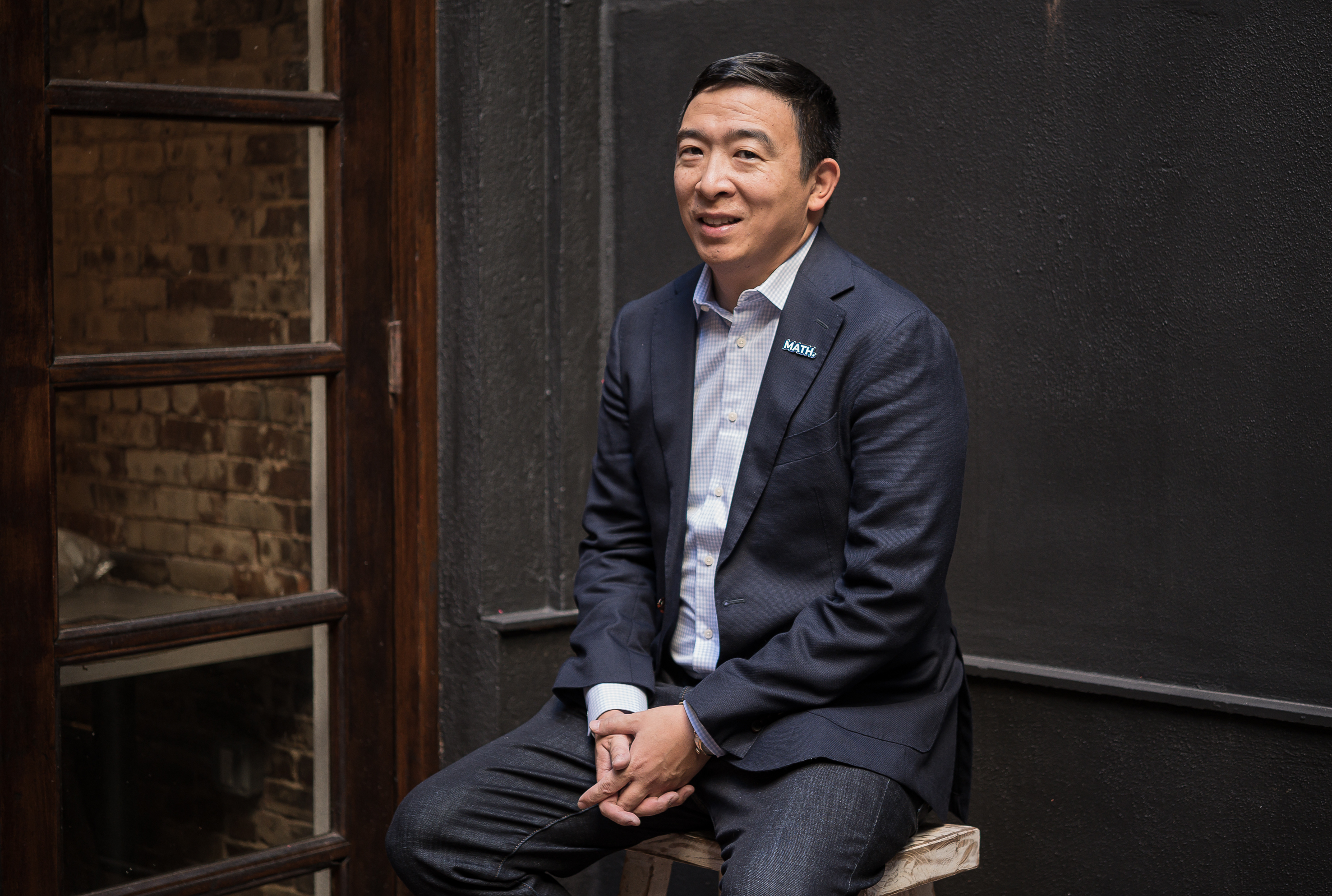 Entrepreneur and presidential hopeful Andrew Yang prepares for a meeting with undecided voters in Manhattan. (A.J. Chavar for NPR)