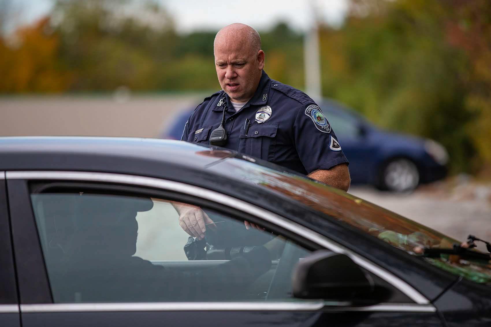 Officer Brian Cregg checks in with a man who says he is homeless and living in his car in Concord, N.H. In Concord, as in many parts of the Northeast, widespread use of meth is new, police say, and is changing how they approach interactions with people who seem to be delusional. (WBUR)