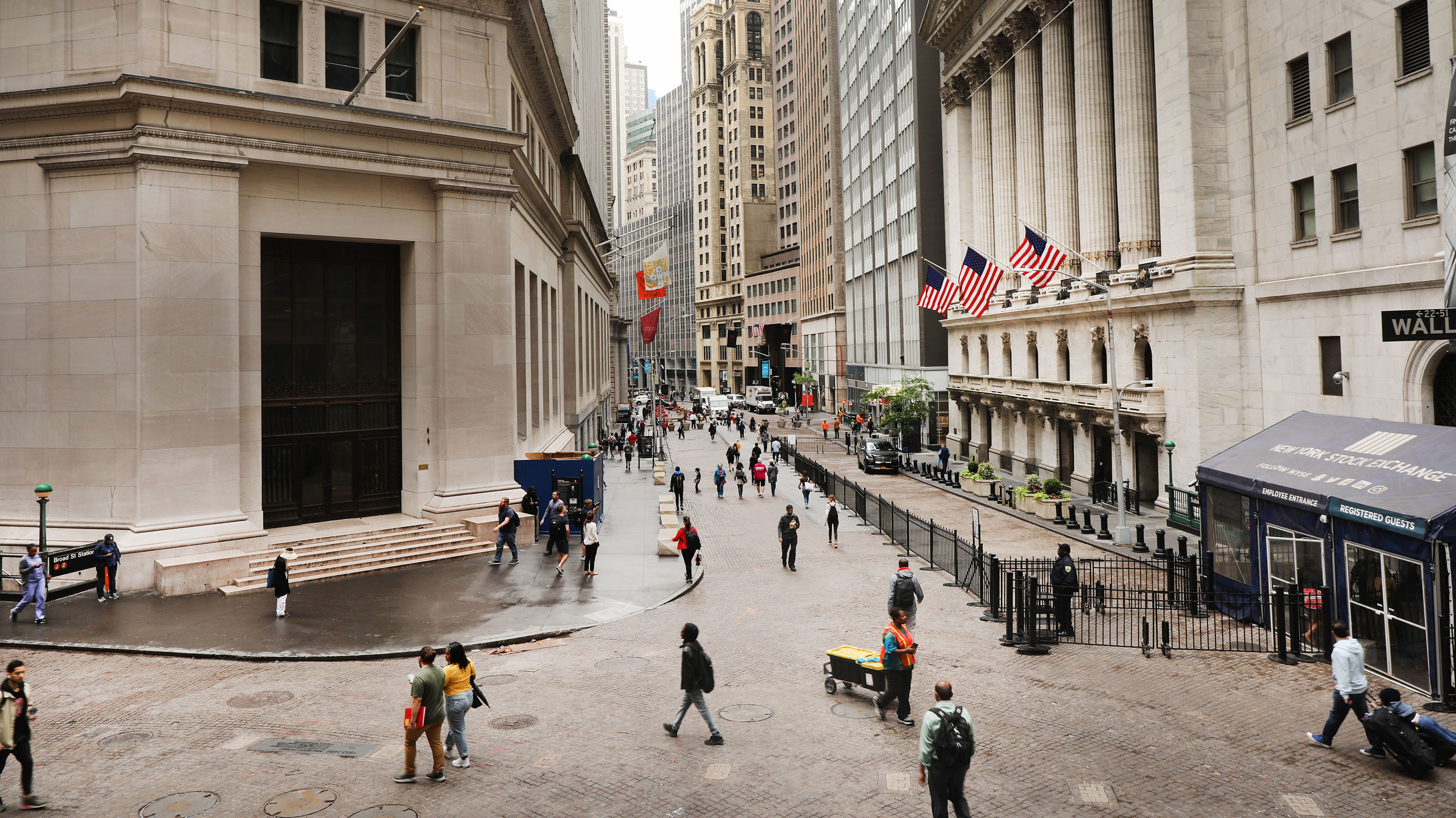 Investors are spending billions of dollars to align their portfolios with their personal values. But there's little agreement on what exactly qualifies — or disqualifies — an investment option from being marketed as sustainable. Above, pedestrians walk past the New York Stock Exchange on June 10.