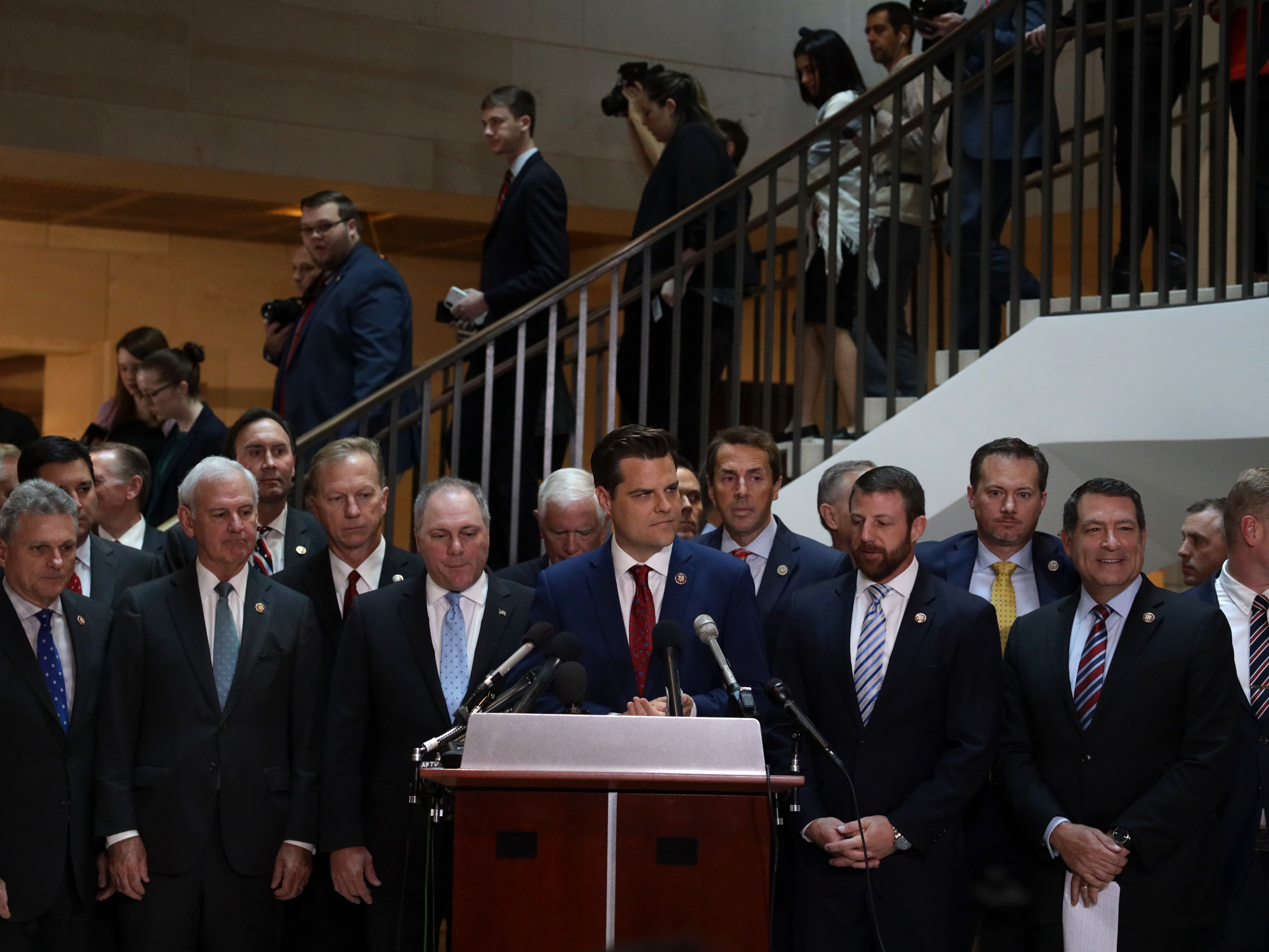 Flanked by about two dozen House Republicans, U.S. Rep. Matt Gaetz, R-Fla., argues that all GOP lawmakers should have access to closed-door depositions in the impeachment inquiry. Committee rules dictate that only those on the panels conducting the probe can attend. (Getty Images)