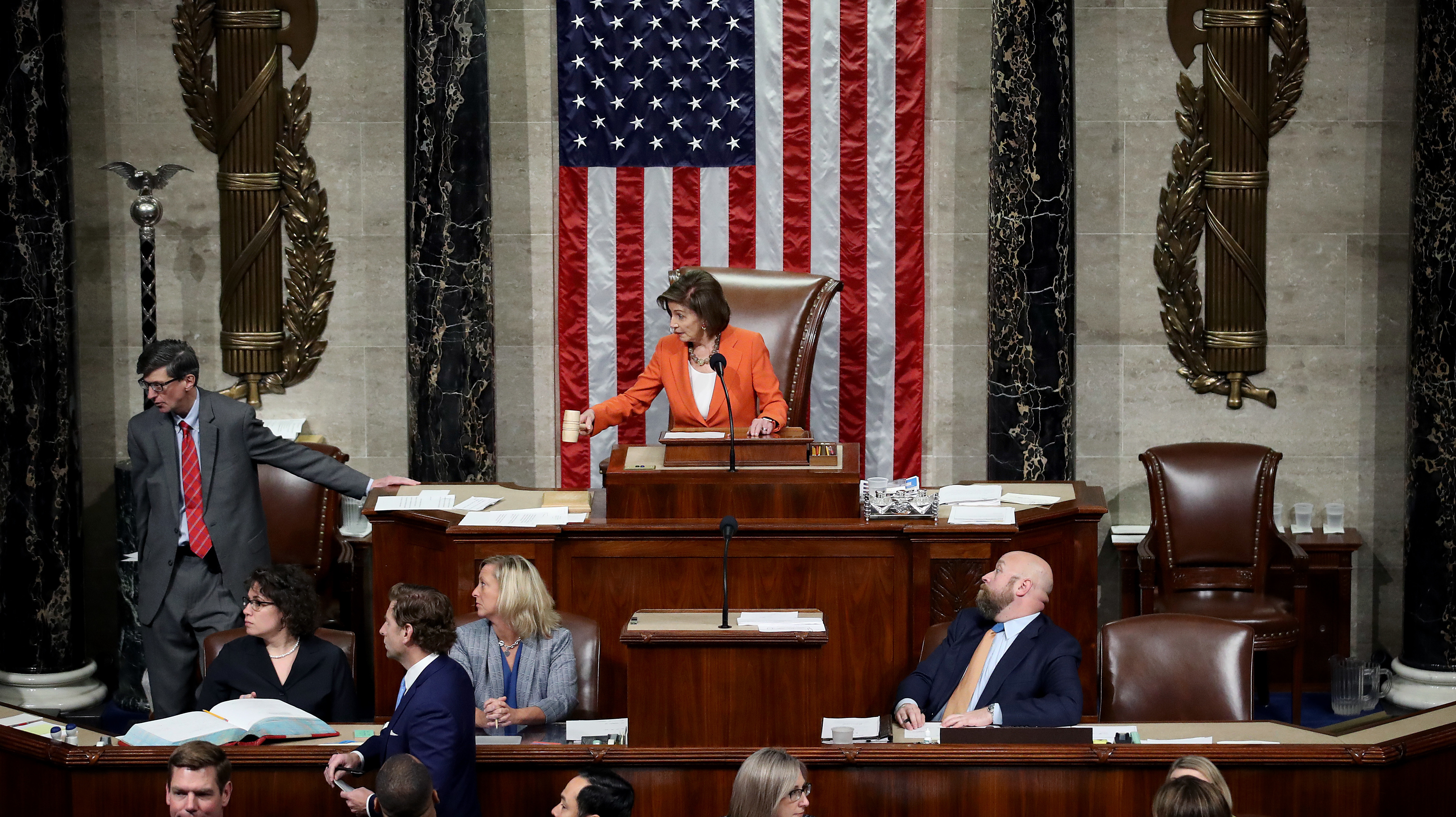 Speaker of the House Nancy Pelosi gavels the close of the vote by the U.S. House of Representatives on a resolution formalizing the impeachment inquiry into President Trump. (Getty Images)