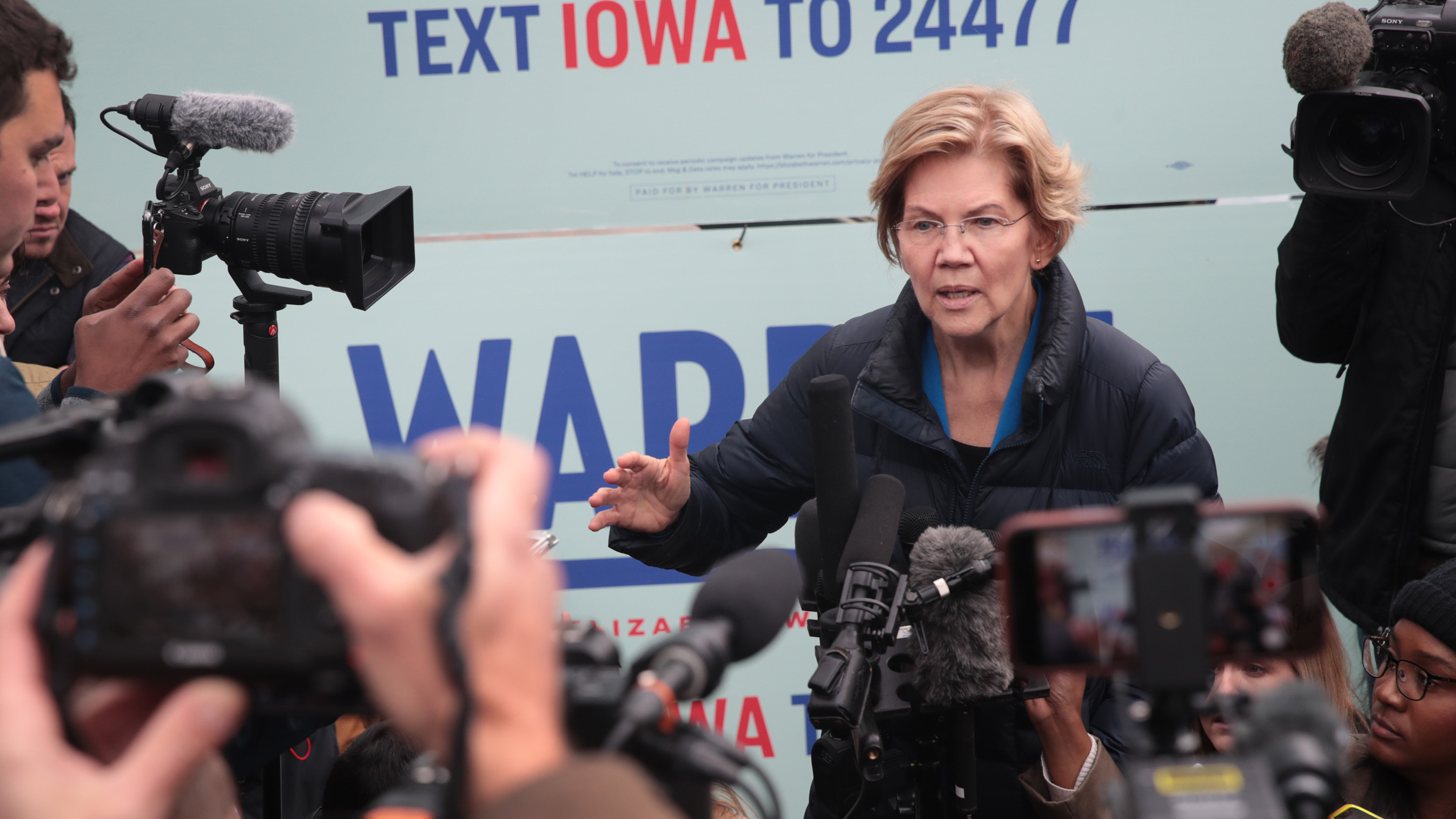 Sen. Elizabeth Warren speaks to reporters in Des Moines, Iowa, on Friday, after releasing her plan to pay for single-payer health care. (Getty Images)