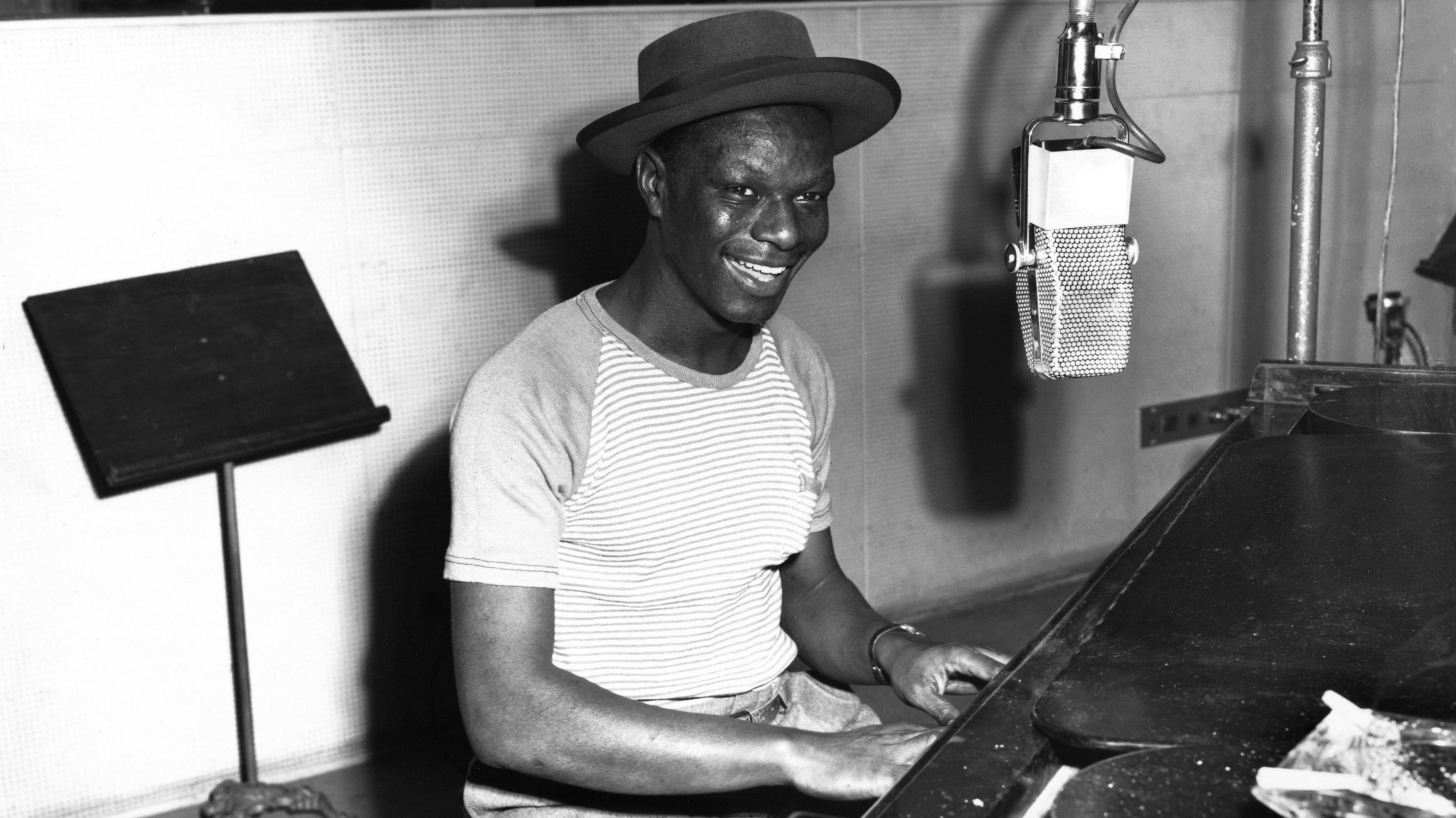 Nat King Cole playing piano in the Capitol Records recording studio on May 23, 1945.