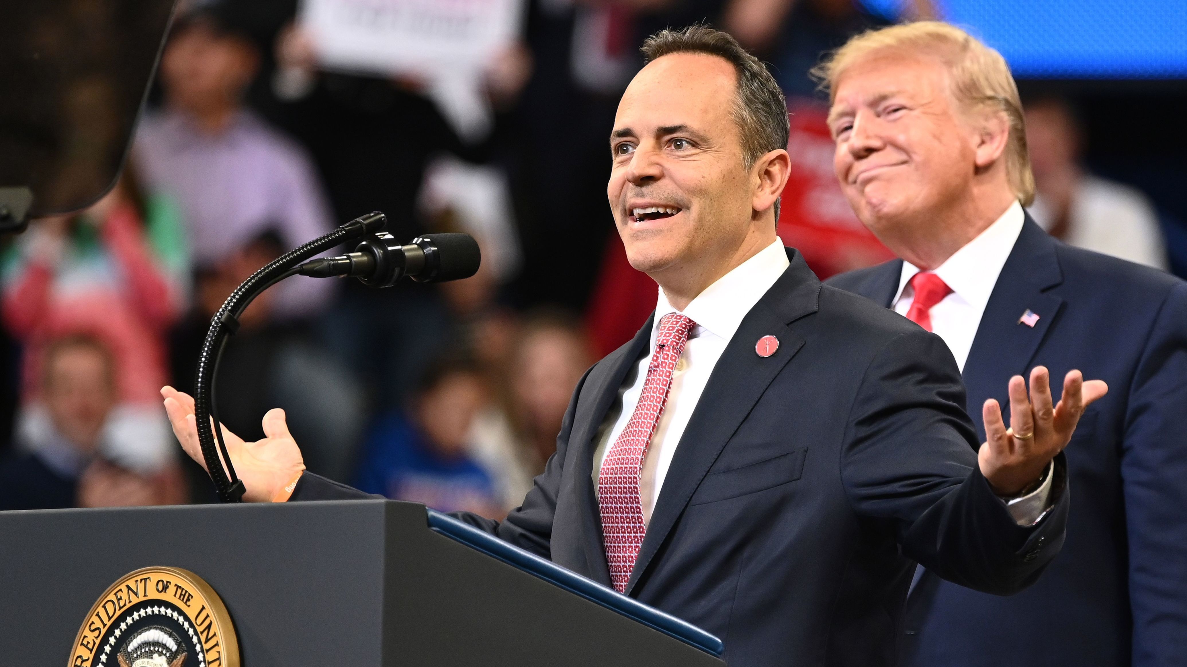 President Trump smiles behind Kentucky Gov. Matt Bevin during a rally at Rupp Arena in Lexington, Ky., on Nov. 4. Both Trump and Bevin have made unsubstantiated claims about election fraud. (AFP via Getty Images)