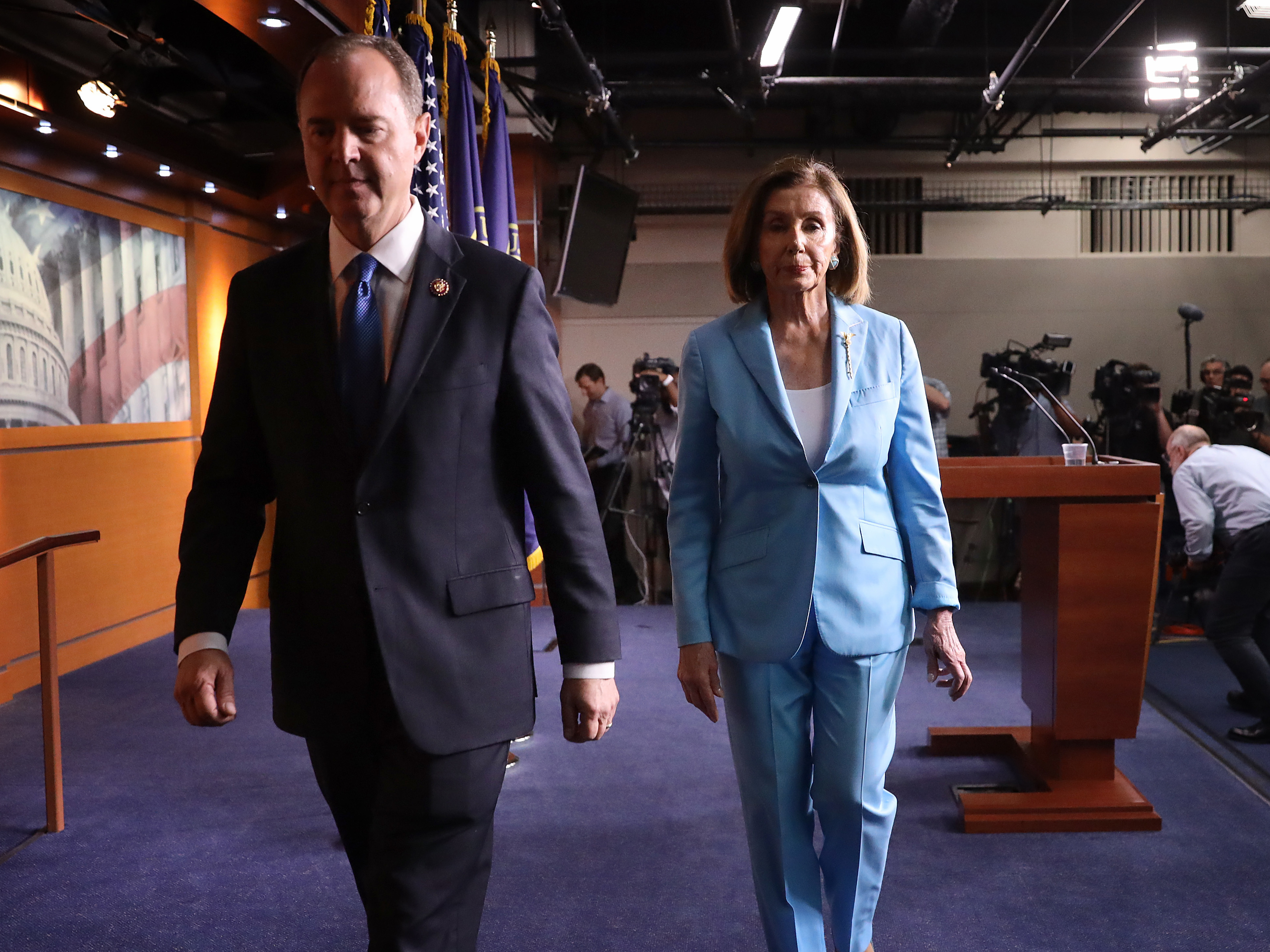Speaker of the House Nancy Pelosi, D-Calif., and Rep. Adam Schiff, D-Calif., depart a press conference at the Capitol on Oct. 2. The impeachment inquiry enters a new phase this week with the start of public hearings. (Getty Images)