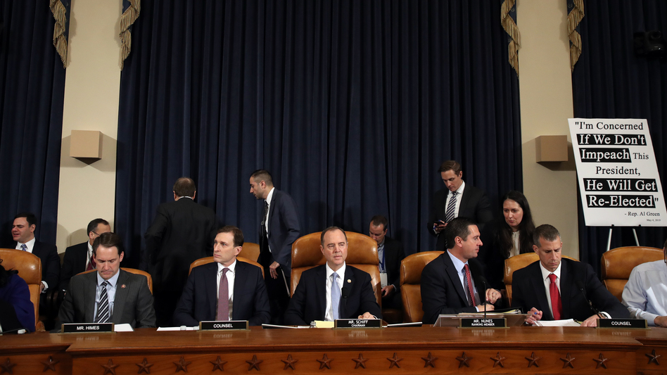 Daniel Goldman, attorney and director of investigations with the House Intelligence Committee (second from left); committee Chairman Adam Schiff, D-Calif; ranking member Rep. Devin Nunes, R-Calif.; and Steve Castor, counsel for the minority, hold the first public hearing of the impeachment inquiry on Capitol Hill on Wednesday. (Drew Angerer/Getty Images)