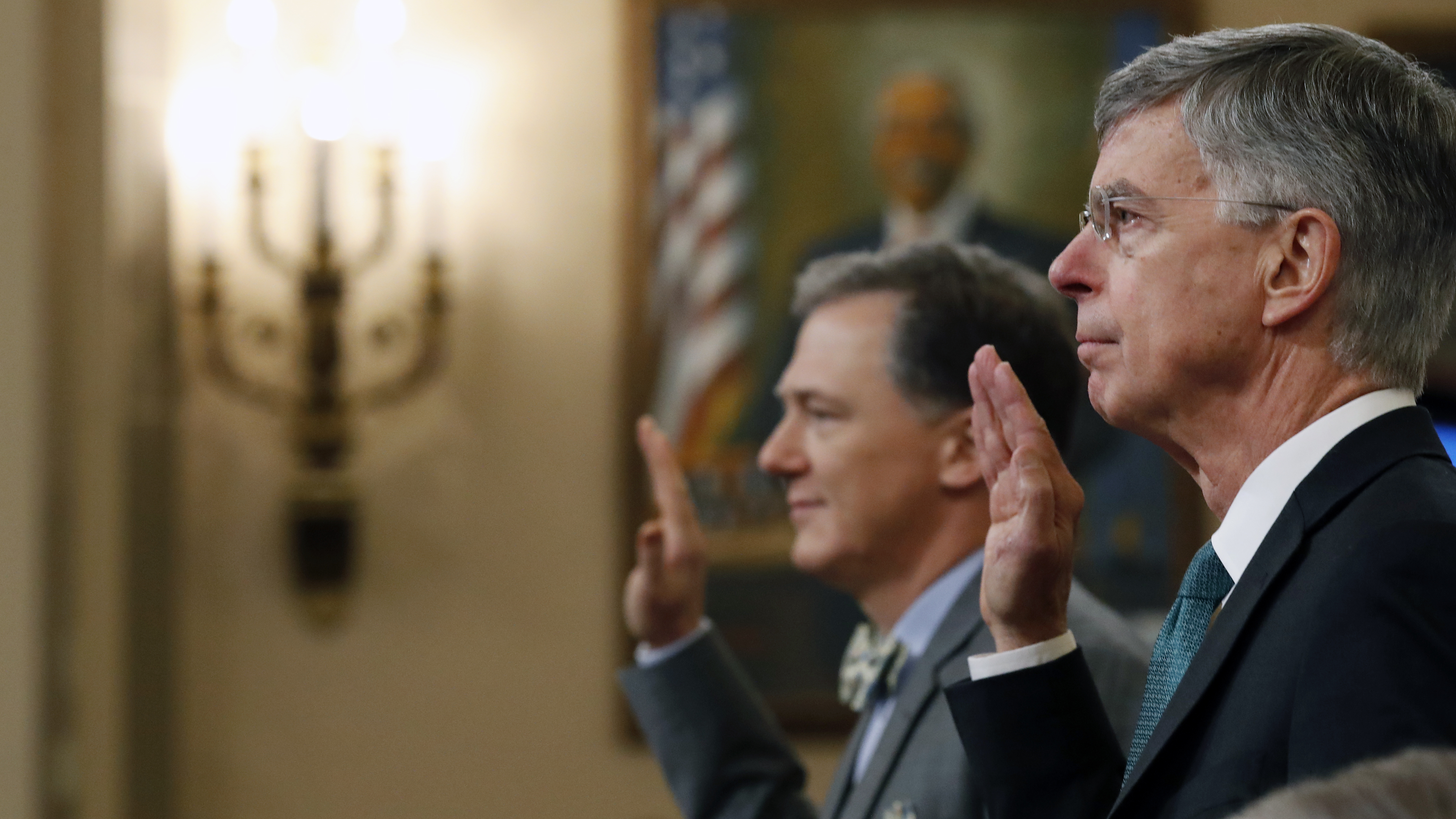 Top U.S. diplomat to Ukraine William Taylor (right) and Deputy Assistant Secretary for European and Eurasian Affairs George Kent are sworn in to testify before the House Intelligence Committee on Wednesday. (Pool/Getty Images)