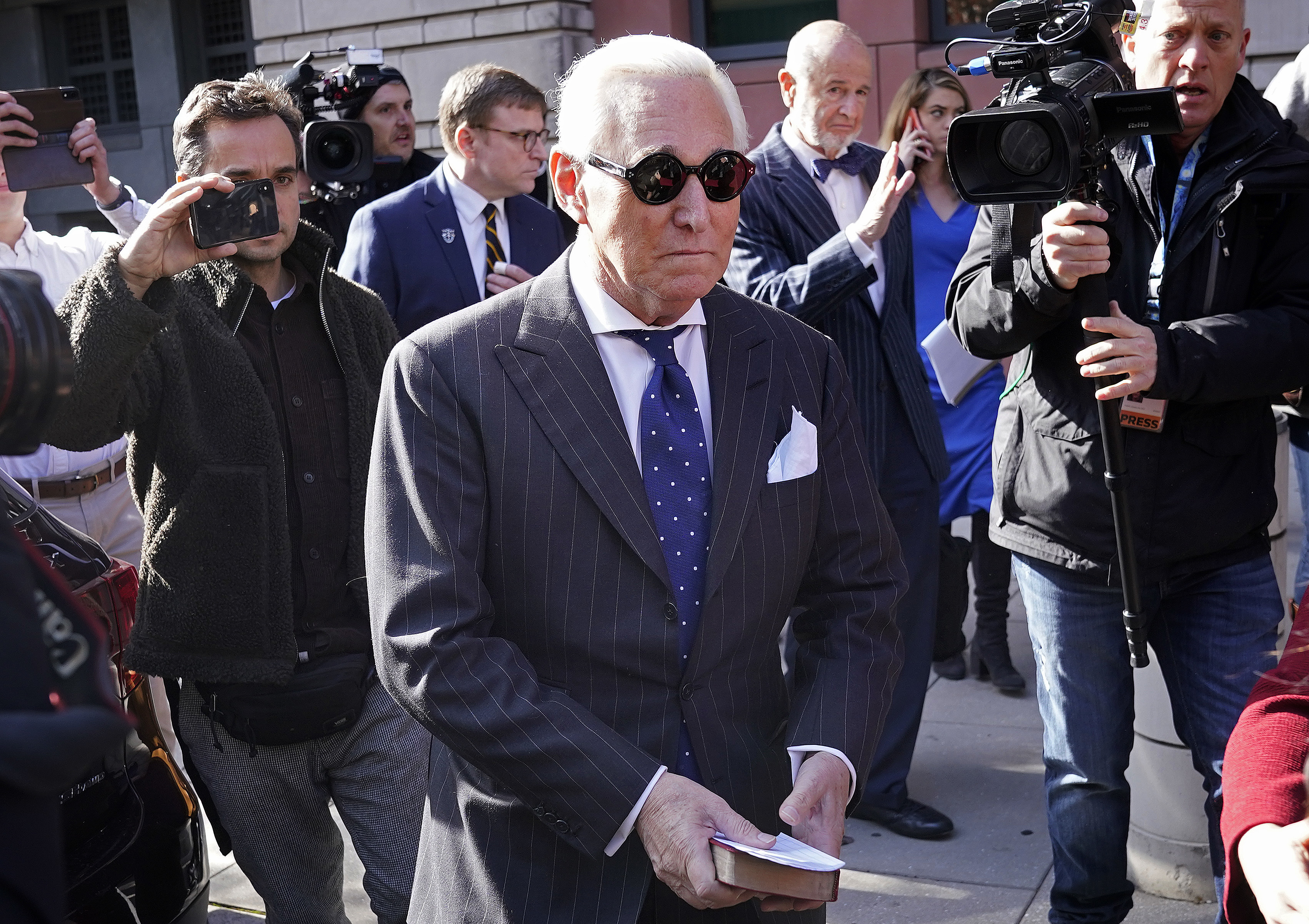 Former Trump adviser Roger Stone leaves a Washington, D.C., courthouse Friday after being found guilty of obstructing a congressional investigation into Russia's interference in the 2016 election. (Getty Images)