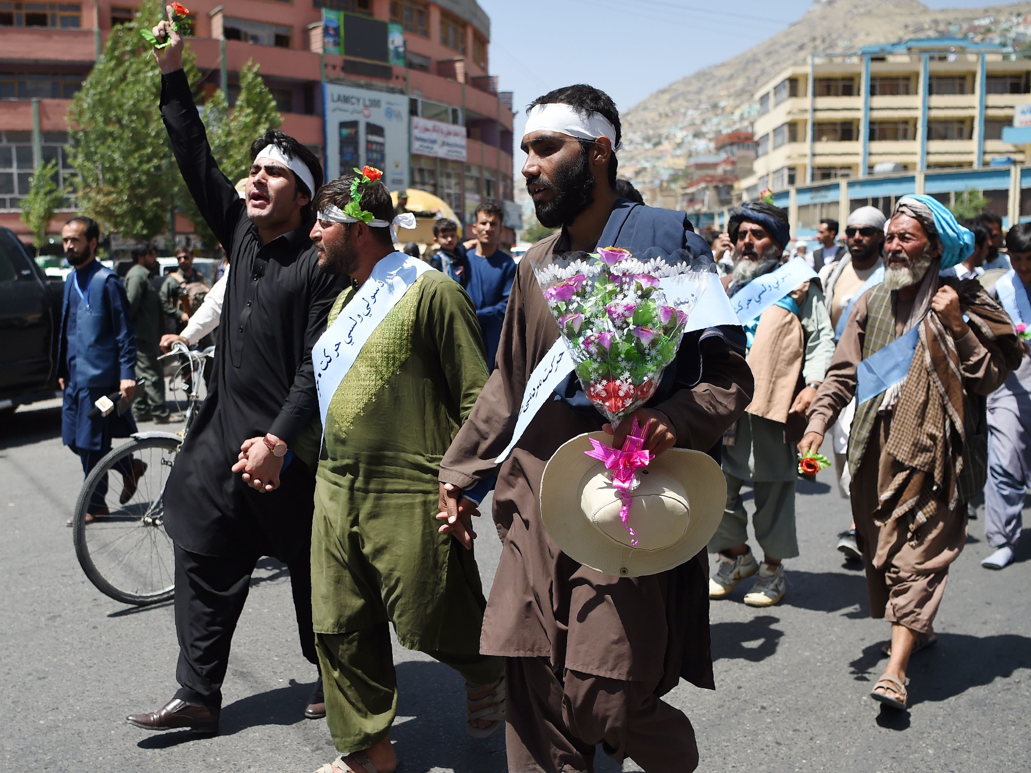 Afghan peace activists demand an end to war as they arrive in Kabul in June 2018, after marching hundreds of miles from Helmand. (AFP via Getty Images)