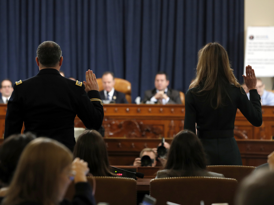 Jennifer Williams (right) and Lt. Col. Alexander Vindman are sworn in to testify before the House Intelligence Committee on Capitol Hill on Tuesday. (Jacquelyn Martin/AP)