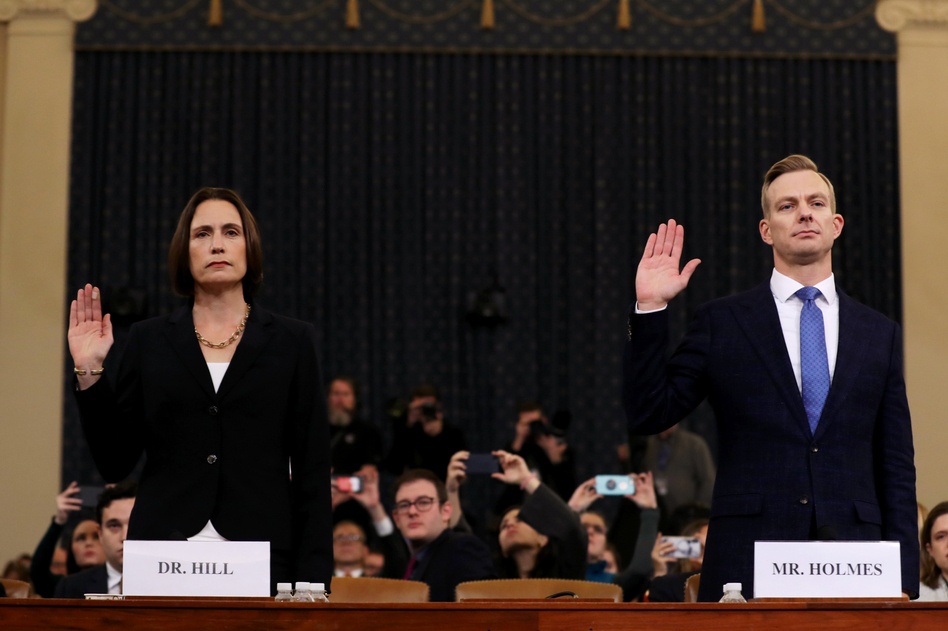 Fiona Hill (left), the National Security Council's former senior director for Europe and Russia, and David Holmes, an official from the American Embassy in Ukraine, are sworn in to testify before the House Intelligence Committee in the Longworth House Office Building on Capitol Hill on Thursday. (Chip Somodevilla/Getty Images)