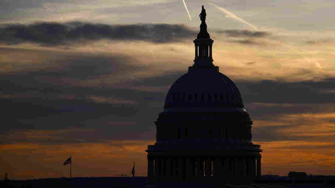 WASHINGTON, DC - NOVEMBER 13: Streaks in the sky form at sunset behind the U.S. Capitol Building on November 13, 2019 in Washington, DC.