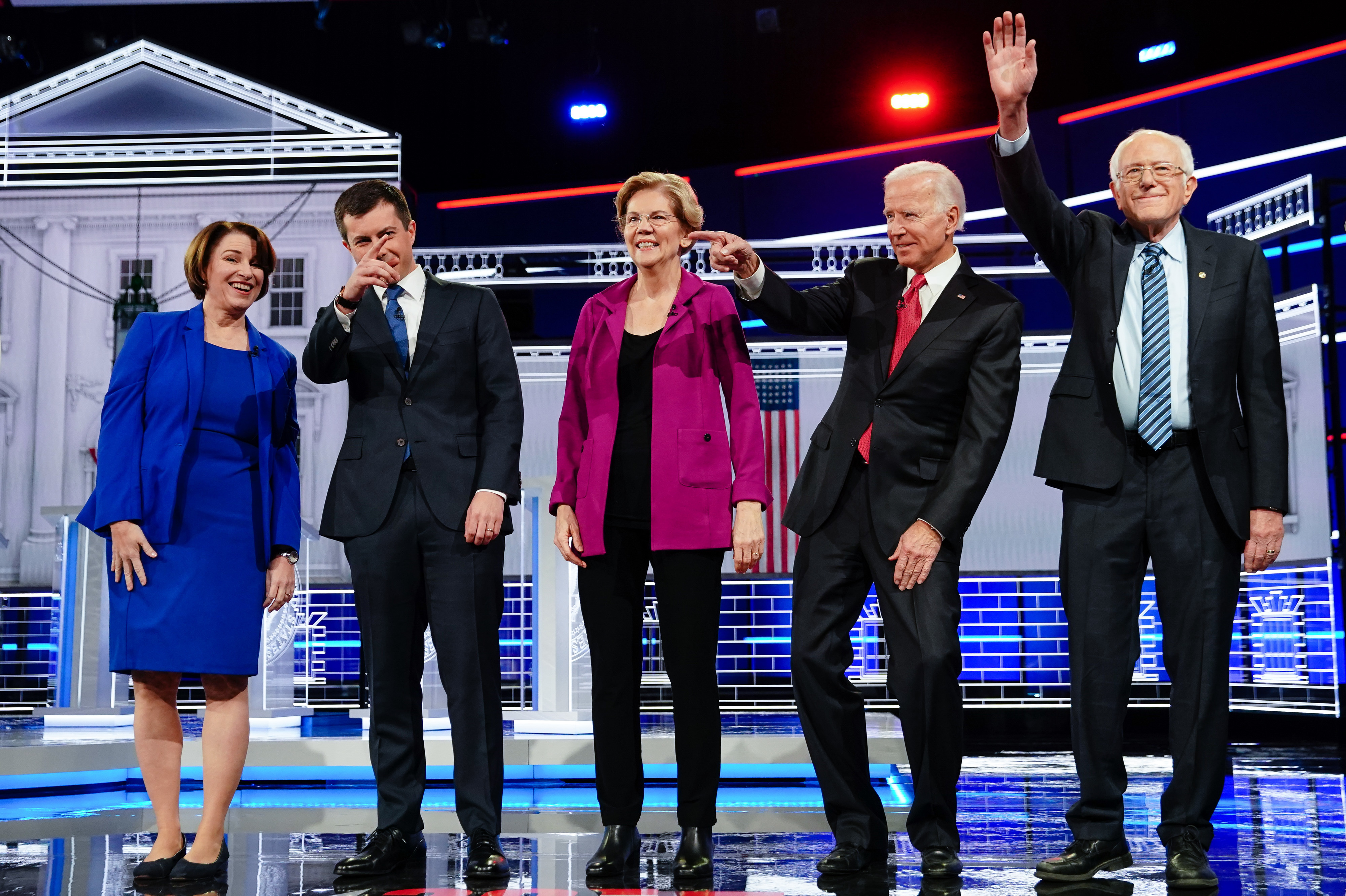 Presidential candidates Sen. Amy Klobuchar; Sound Bend, Ind., Mayor Pete Buttigieg; Sen. Elizabeth Warren; former U.S. Vice President Joe Biden; and Sen. Bernie Sanders stand onstage for the Democratic presidential debate on Wednesday. (Bloomberg via Getty Images)