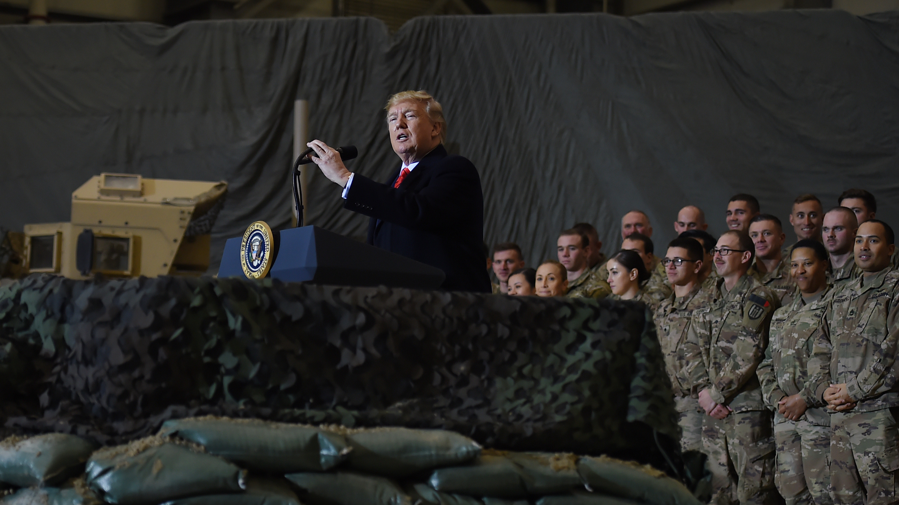 President Trump addresses U.S. troops Thursday during a surprise visit to Bagram Airfield in Afghanistan. (AFP via Getty Images)