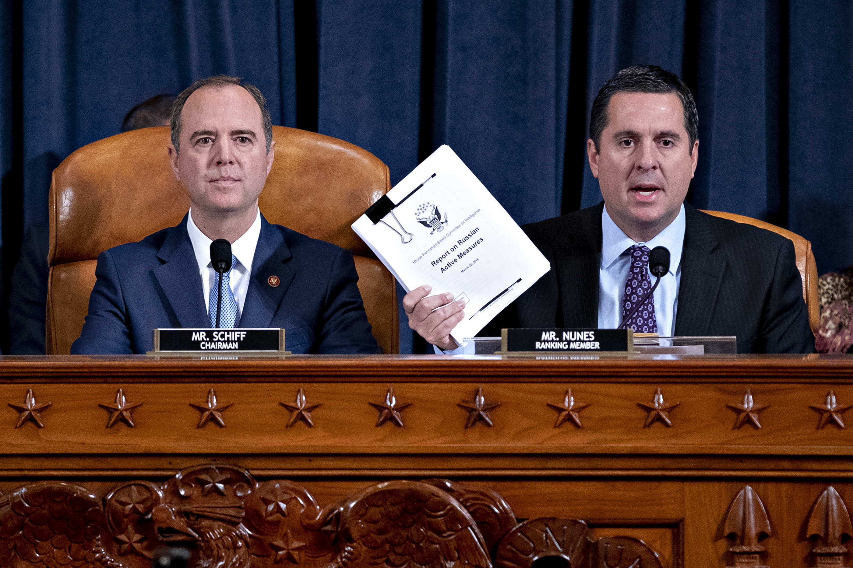 Rep. Devin Nunes, R-Calif., ranking member of the House Intelligence Committee (right), speaks as Rep. Adam Schiff, D-Calif., chairman of the House Intelligence Committee, listens during an impeachment inquiry hearing on Capitol Hill on Nov. 21. (Getty Images)
