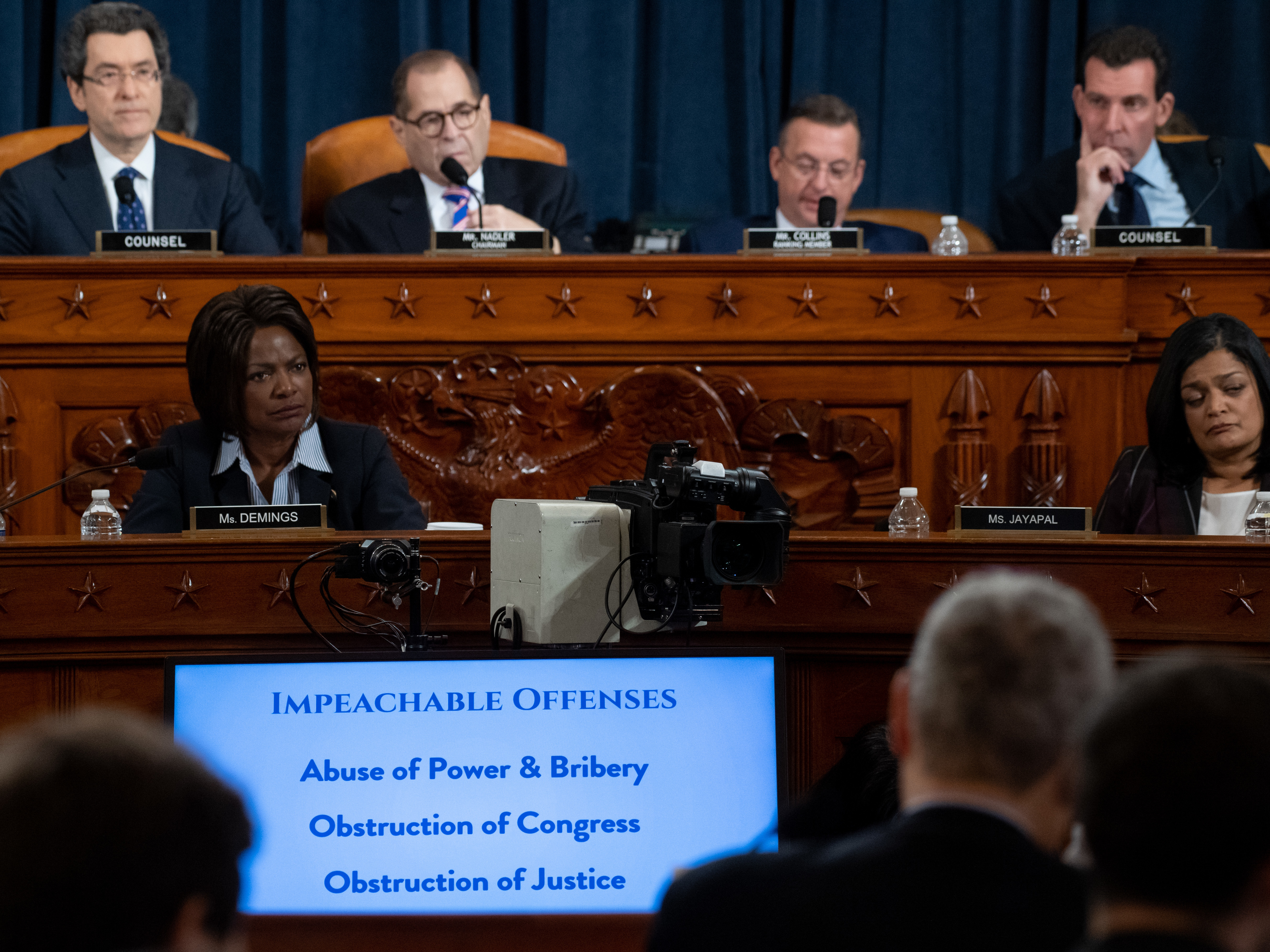 Impeachable offenses were listed on a monitor as the House Judiciary Committee listened to testimony by constitutional scholars earlier this week. (Getty Images)