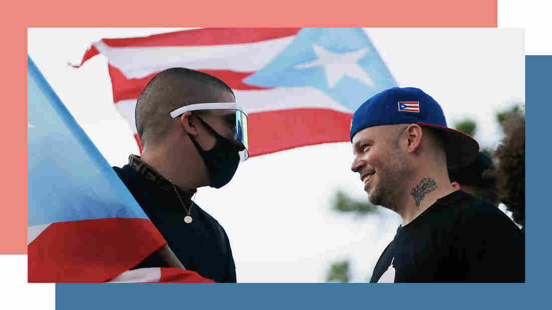 Rappers Bad Bunny (left) and Residente join thousands of demonstrators protesting against Governor Ricardo Rosselló on July 17, 2019, in front of the Capitol Building in Old San Juan, Puerto Rico. Rosselló stepped down a few weeks later.