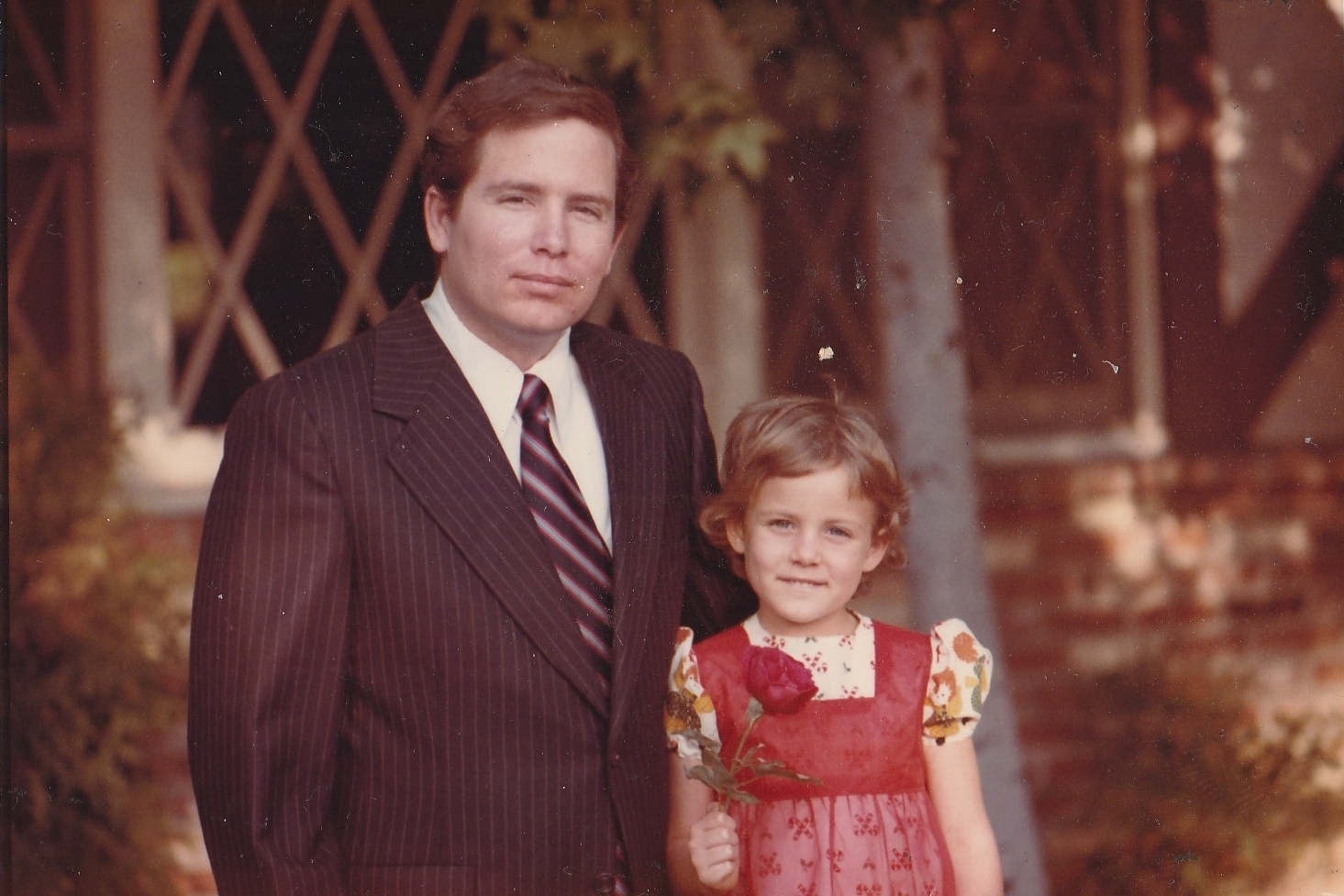Stephanie Hofeller stands with her father, Thomas, for a family photo in California during the 1970s. Republicans fought to stop computer files found on the redistricting expert's hard drives from going public — now Stephanie is sharing them online. (Courtesy of Stephanie Hofeller)
