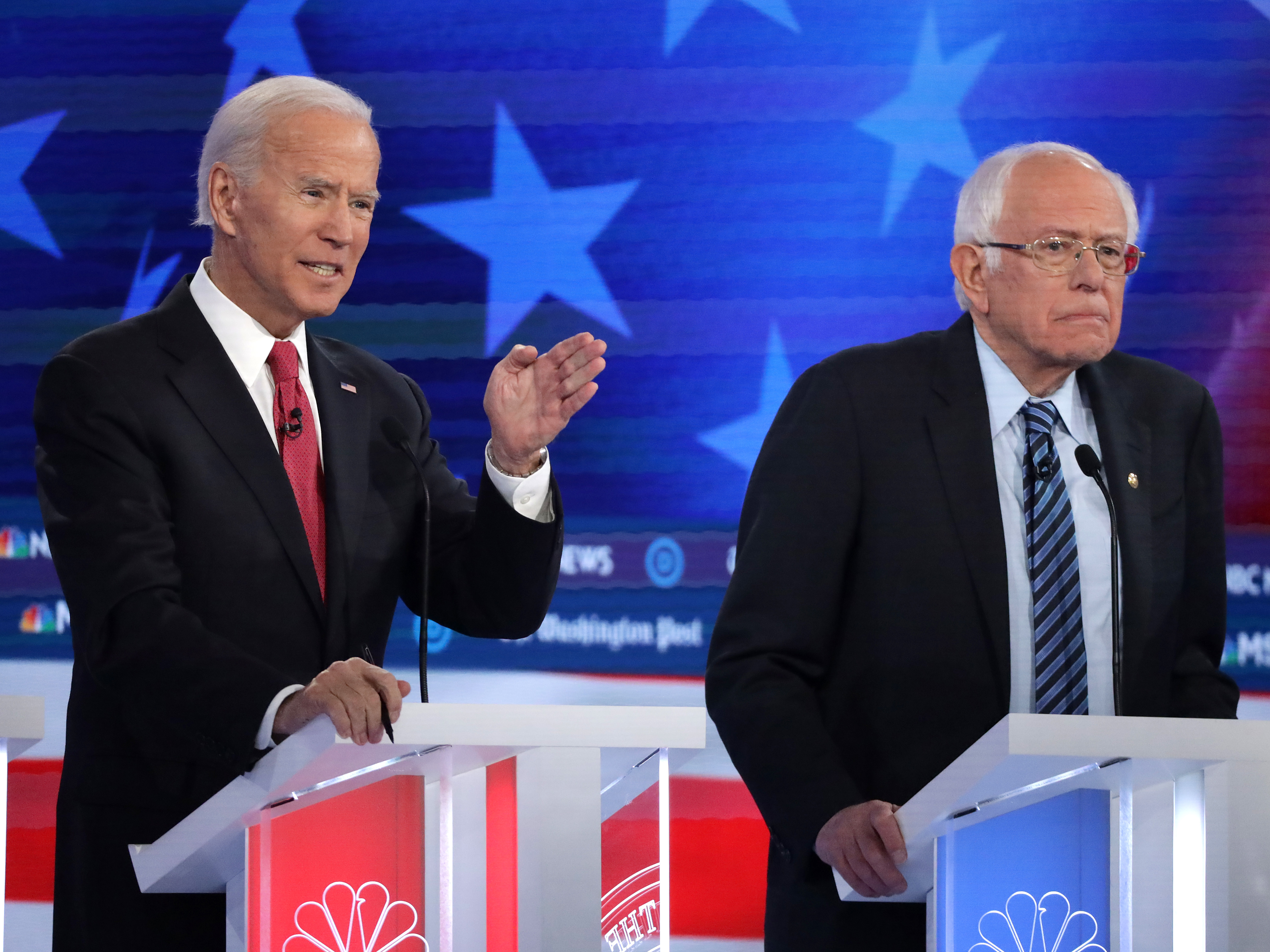 Former Vice President Joe Biden (left) and Sen. Bernie Sanders lead the crowded Democratic presidential primary field, according to the latest NPR/<em>PBS NewsHour/</em>Marist Poll. Above, they appear during the Democratic presidential primary debate in Atlanta on Nov. 20. (Getty Images)