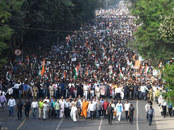 Protests against India's new citizenship law include a "mega rally" in Kolkata, where West Bengal Chief Minister Mamata Banerjee, in white, led a protest against the Citizenship Amendment Act Monday.