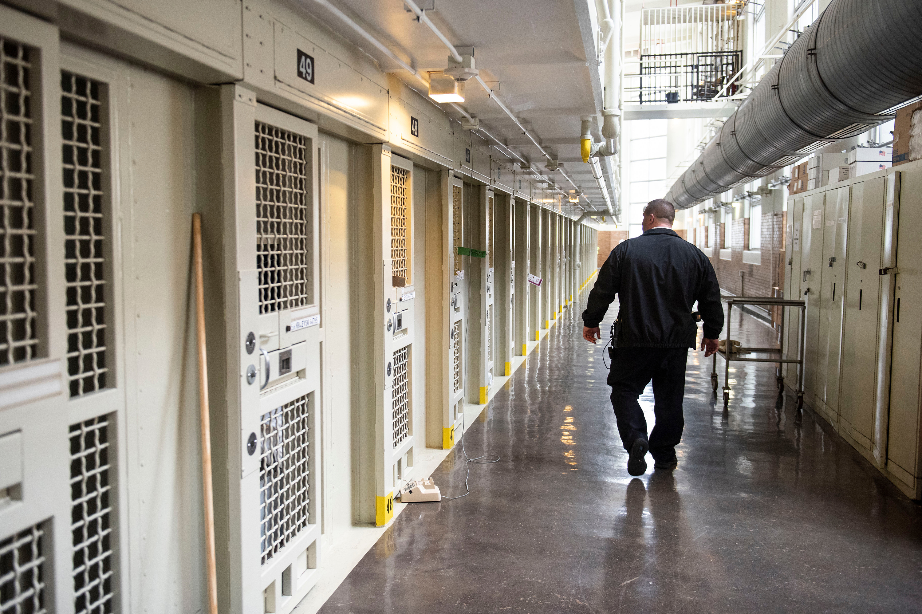 Lt. Keith Immerfall walks past prison cells at Waupun Correctional Institution, a maximum security prison in Waupun, Wis. If the more than 1,200 prisoners at the facility are still incarcerated there on April 1, the next Census Day, the Census Bureau will officially consider them residents of Waupun for the 2020 national head count. (Lauren Justice for NPR)