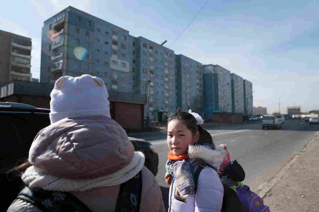 Muguntuul Oyutan, 11, walks to school with her sister and friends in Ulaanbaatar, the capital of Mongolia. Mongolia is the world's most sparsely populated nation, and an increasing proportion of its citizens reside in the capital.