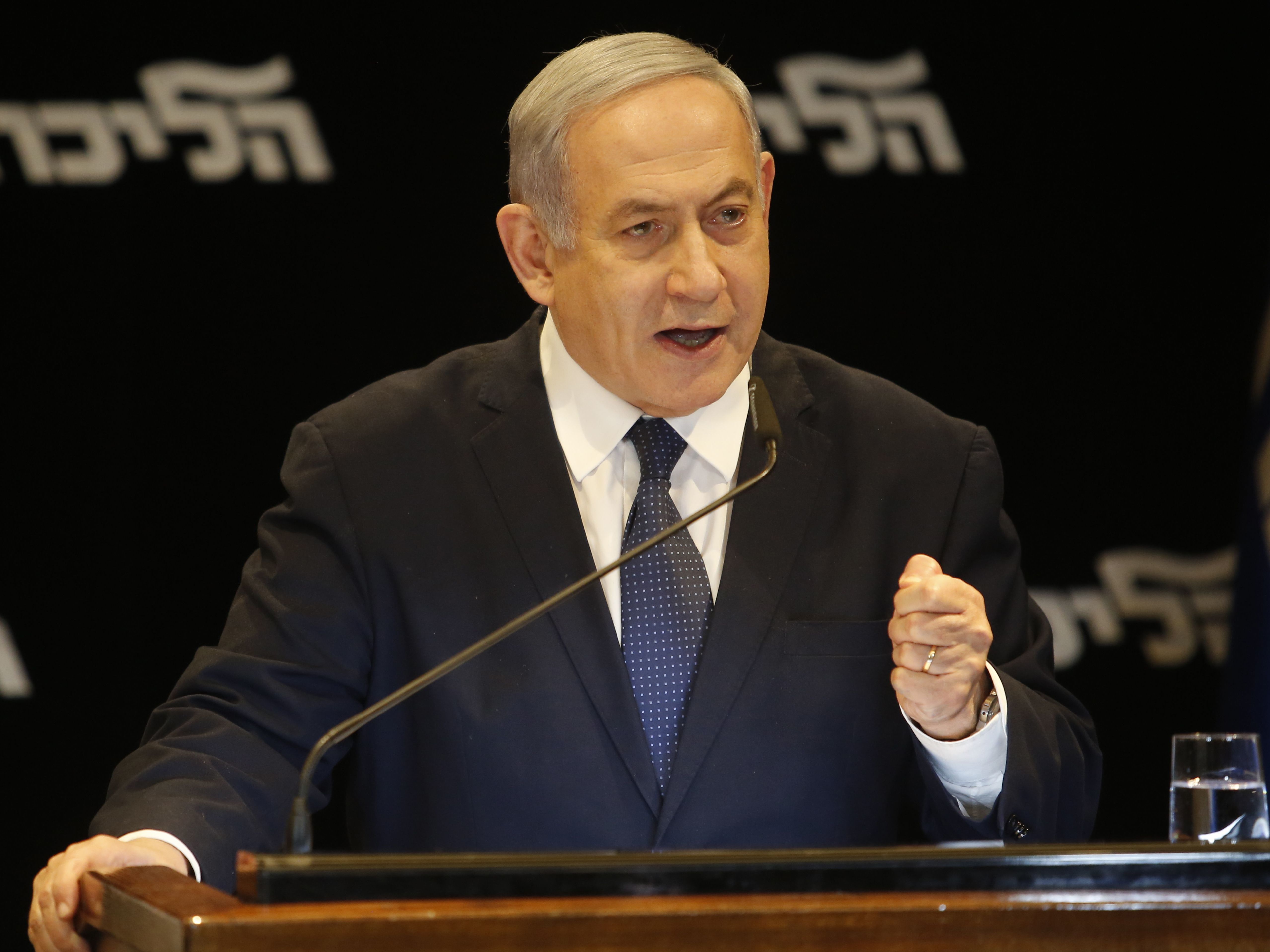 Israeli Prime Minister Benjamin Netanyahu speaks at a press conference Wednesday in Jerusalem regarding his intention to file a request to the Knesset for immunity from prosecution. (AFP via Getty Images)