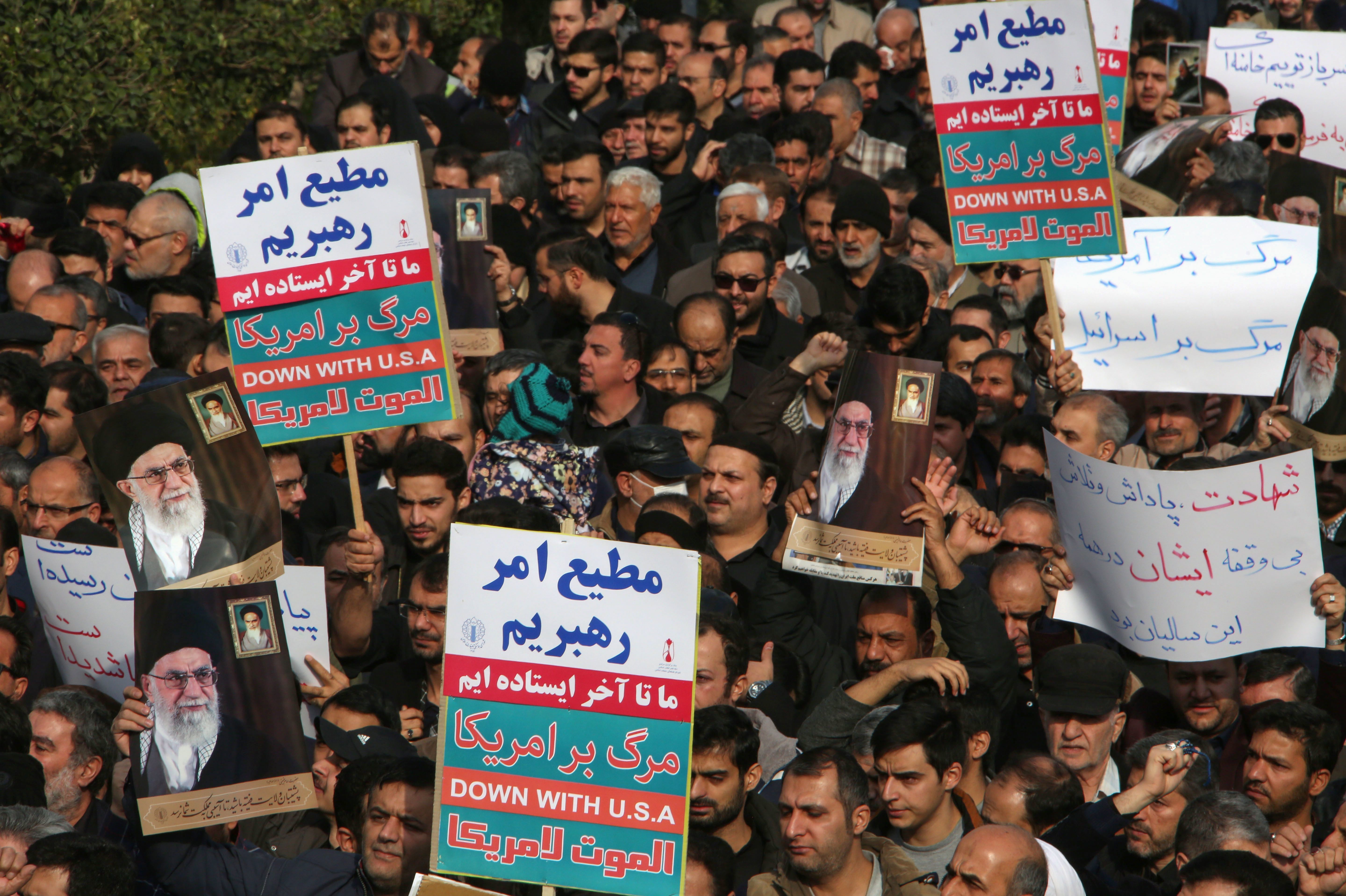 Iranians hold anti-U.S. banners during a demonstration in the capital, Tehran, following the killing of Qasem Soleimani by a U.S. drone strike. (AFP via Getty Images)